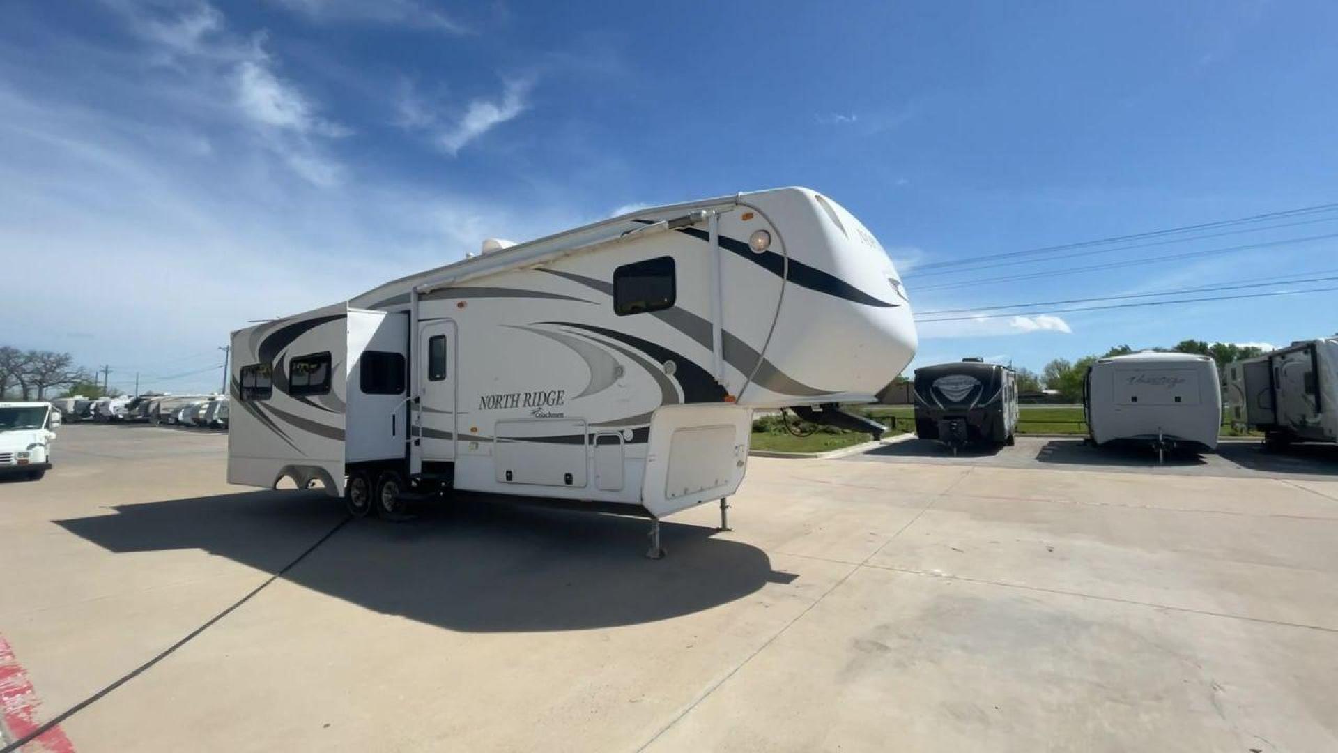 2012 COACHMEN NORTH RIDGE 320RLQ (5ZT3NRXB6CA) , Length: 37.17 ft. | Dry Weight: 10,405 lbs. | Gross Weight: 15,000 lbs. | Slides: 4 transmission, located at 4319 N Main St, Cleburne, TX, 76033, (817) 678-5133, 32.385960, -97.391212 - The 2012 Coachmen North Ridge 320RLQ is a 37-foot fifth wheel with four slides and an aluminum frame. With the quadruple slides, space and storage will never be an issue! The unit also comes with automatic heating and cooling rated at 40,000 and 15,000 BTUs, respectively. The interior has beautiful - Photo#3