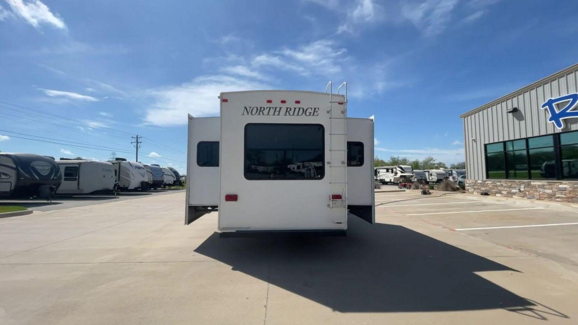 2012 COACHMEN NORTH RIDGE 320RLQ (5ZT3NRXB6CA) , Length: 37.17 ft. | Dry Weight: 10,405 lbs. | Gross Weight: 15,000 lbs. | Slides: 4 transmission, located at 4319 N Main St, Cleburne, TX, 76033, (817) 678-5133, 32.385960, -97.391212 - The 2012 Coachmen North Ridge 320RLQ is a 37-foot fifth wheel with four slides and an aluminum frame. With the quadruple slides, space and storage will never be an issue! The unit also comes with automatic heating and cooling rated at 40,000 and 15,000 BTUs, respectively. The interior has beautiful - Photo#8