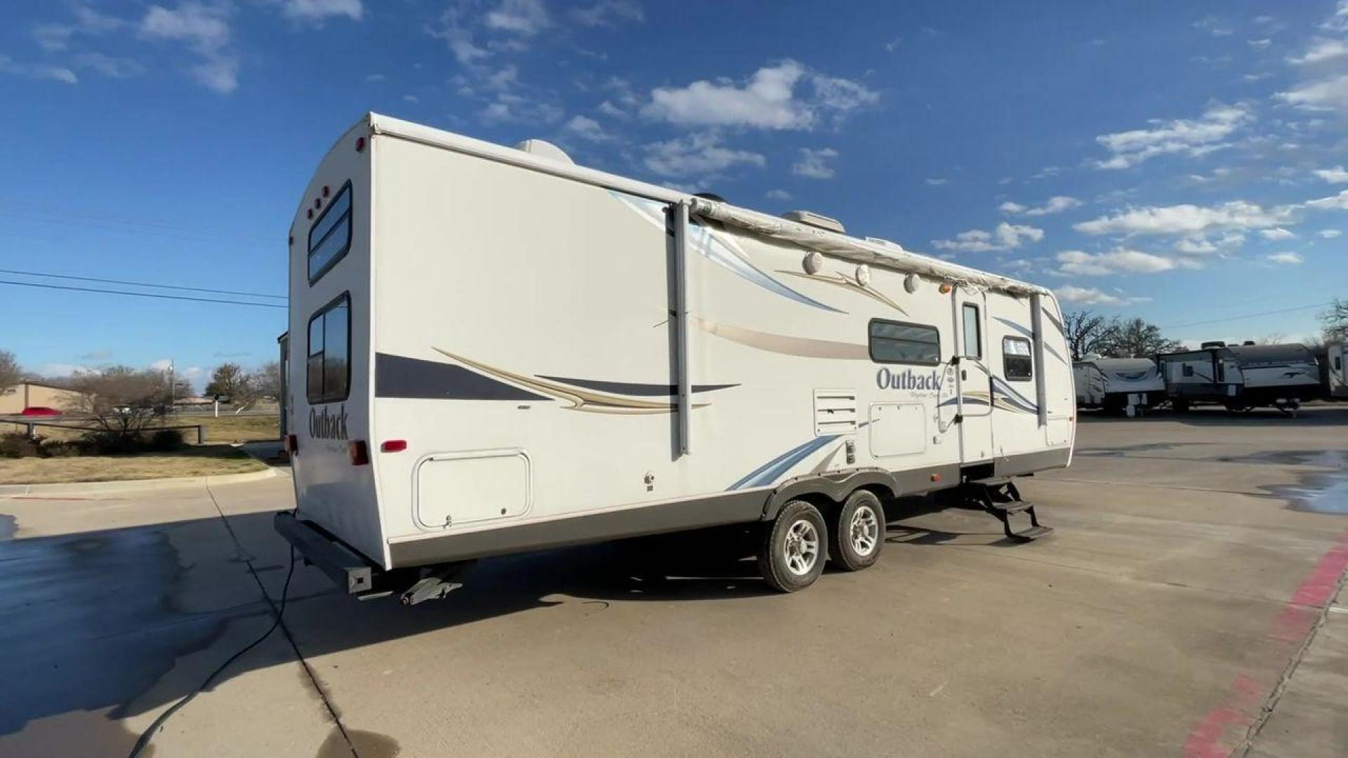 2012 WHITE KEYSTONE OUTBACK 292BH (4YDT29225CB) , Length: 32.75 | Dry Weight: 6,559 lbs. | Gross Weight: 8,200 lbs. | Slides: 1 transmission, located at 4319 N Main St, Cleburne, TX, 76033, (817) 678-5133, 32.385960, -97.391212 - The 2012 Keystone Outback 292BH is a versatile and well-equipped travel trailer perfect for enjoyable family adventures. This model offers a great balance between spaciousness and towability, with a length of 32.75 feet and a dry weight of 6,559 pounds. With a single slide, the Outback 292BH provide - Photo#1