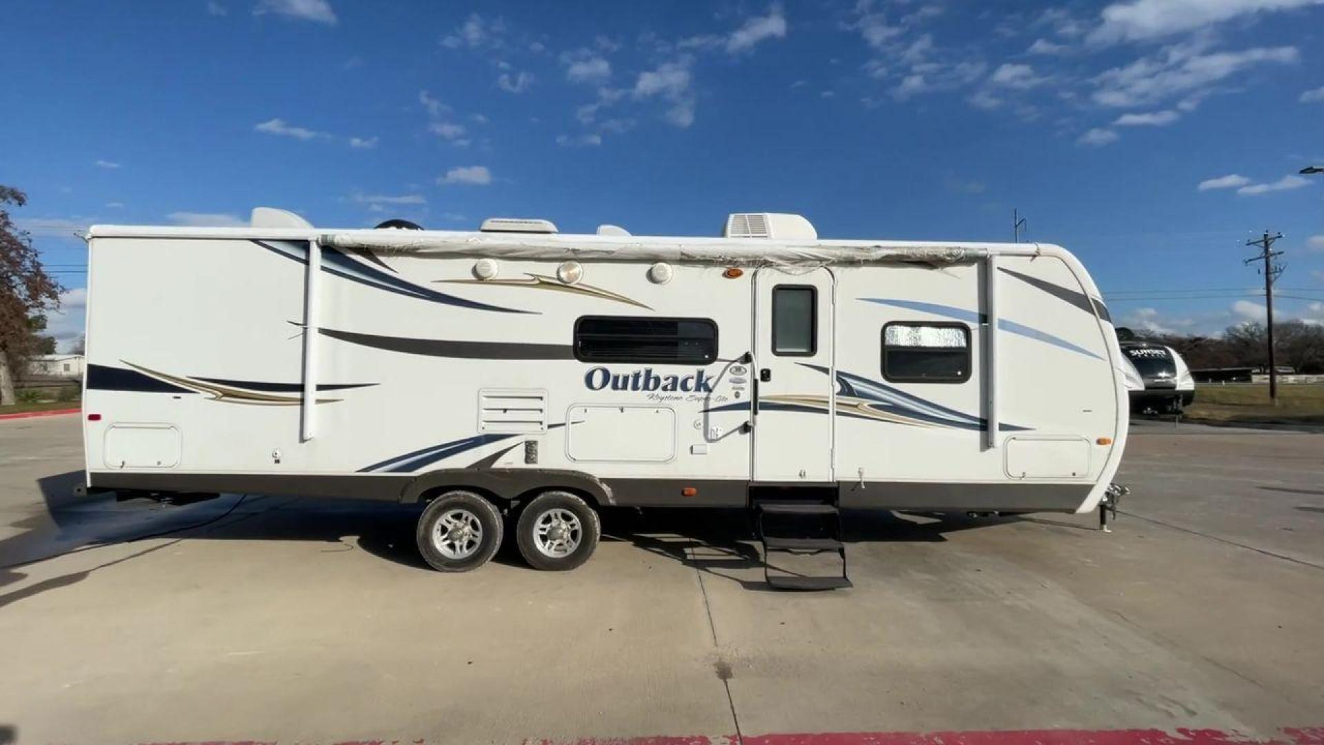 2012 WHITE KEYSTONE OUTBACK 292BH (4YDT29225CB) , Length: 32.75 | Dry Weight: 6,559 lbs. | Gross Weight: 8,200 lbs. | Slides: 1 transmission, located at 4319 N Main St, Cleburne, TX, 76033, (817) 678-5133, 32.385960, -97.391212 - The 2012 Keystone Outback 292BH is a versatile and well-equipped travel trailer perfect for enjoyable family adventures. This model offers a great balance between spaciousness and towability, with a length of 32.75 feet and a dry weight of 6,559 pounds. With a single slide, the Outback 292BH provide - Photo#2