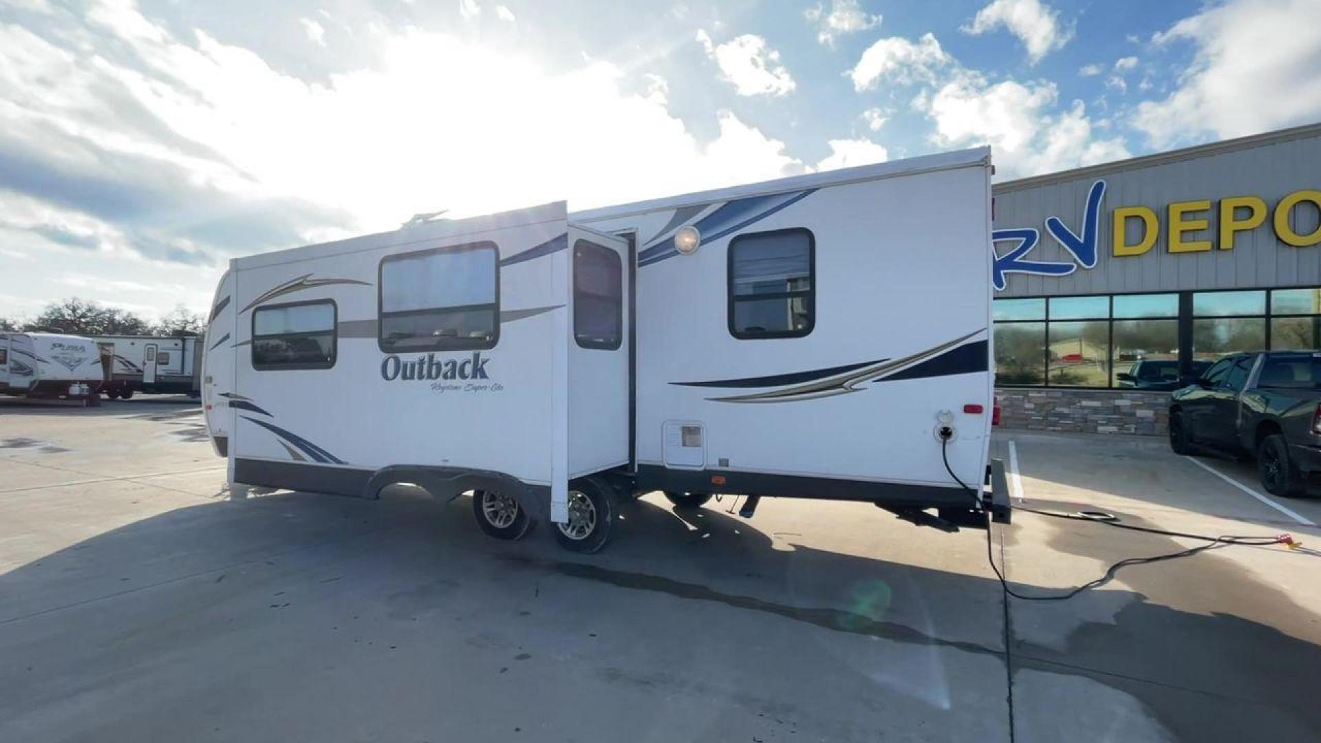 2012 WHITE KEYSTONE OUTBACK 292BH (4YDT29225CB) , Length: 32.75 | Dry Weight: 6,559 lbs. | Gross Weight: 8,200 lbs. | Slides: 1 transmission, located at 4319 N Main St, Cleburne, TX, 76033, (817) 678-5133, 32.385960, -97.391212 - The 2012 Keystone Outback 292BH is a versatile and well-equipped travel trailer perfect for enjoyable family adventures. This model offers a great balance between spaciousness and towability, with a length of 32.75 feet and a dry weight of 6,559 pounds. With a single slide, the Outback 292BH provide - Photo#7