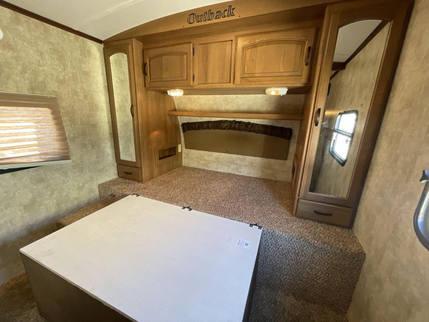 2012 KEYSTONE RV OUTBACK 274RB (4YDT27420CB) , Length: 30.33 ft | Dry Weight: 5,995 lbs. | Gross Weight: 7,800 lbs. | Slides: 1 transmission, located at 4319 N Main St, Cleburne, TX, 76033, (817) 678-5133, 32.385960, -97.391212 - Experience the 2012 Keystone RV Outback 274RB Travel Trailer, the ideal fusion of adventure and comfort. This well-built travel trailer is a great option for any family or couple looking for a roomy and fashionable mobile home. The dimensions of this unit are 30.33 ft in length, 8 ft in width, an - Photo#17