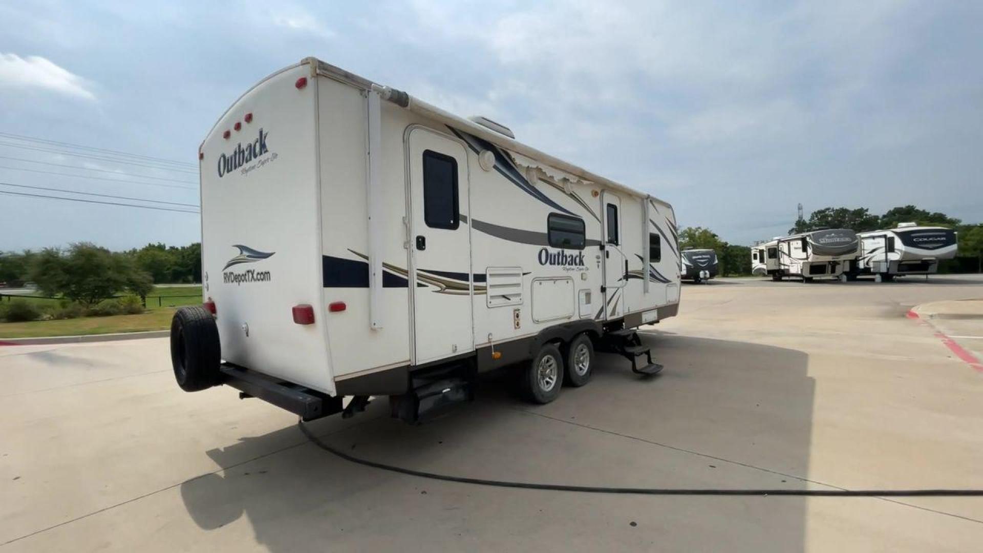 2012 KEYSTONE RV OUTBACK 274RB (4YDT27420CB) , Length: 30.33 ft | Dry Weight: 5,995 lbs. | Gross Weight: 7,800 lbs. | Slides: 1 transmission, located at 4319 N Main St, Cleburne, TX, 76033, (817) 678-5133, 32.385960, -97.391212 - Experience the 2012 Keystone RV Outback 274RB Travel Trailer, the ideal fusion of adventure and comfort. This well-built travel trailer is a great option for any family or couple looking for a roomy and fashionable mobile home. The dimensions of this unit are 30.33 ft in length, 8 ft in width, an - Photo#1