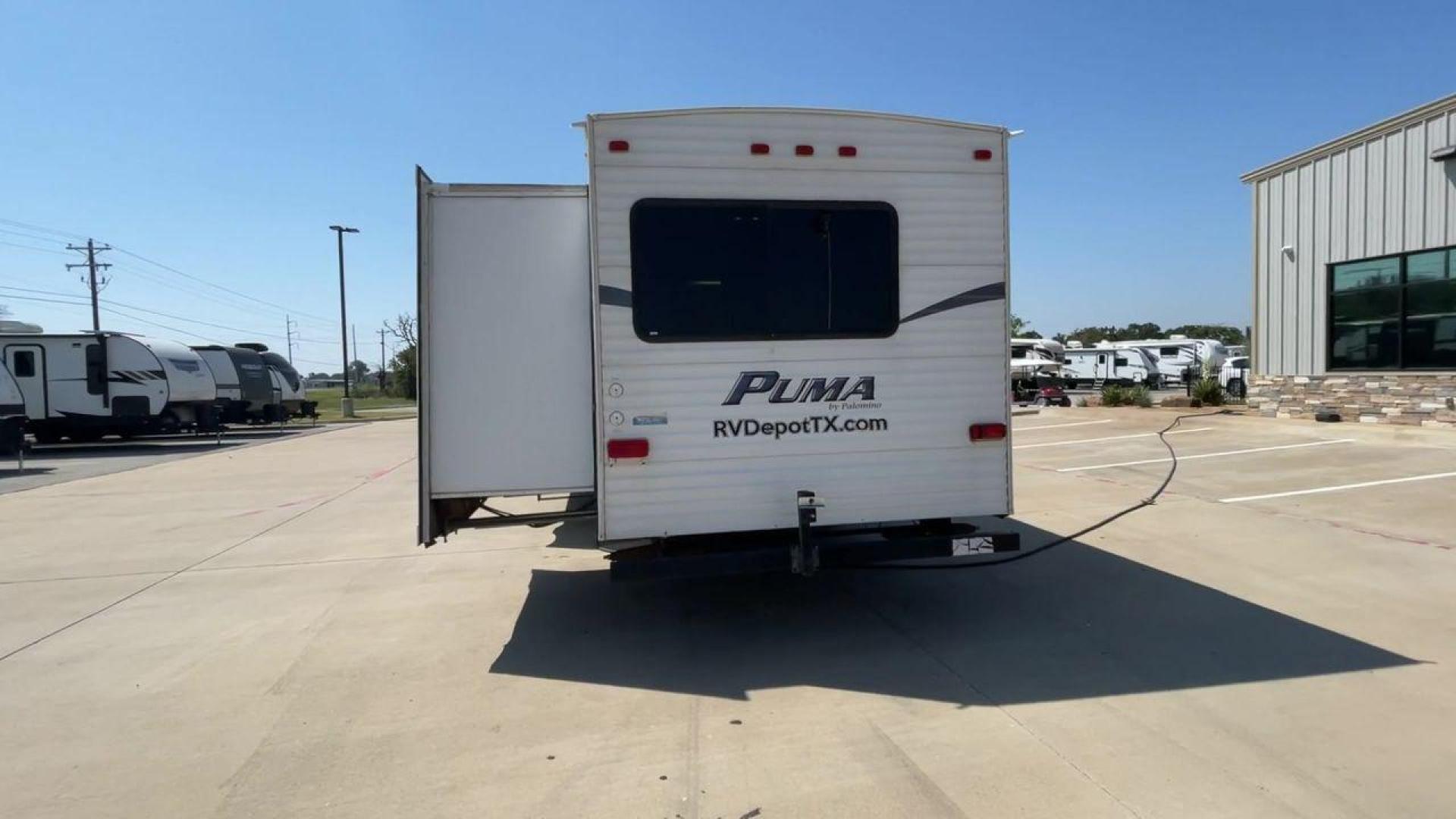 2012 WHITE PUMA 30KFB (4X4TPUF27CP) , Length: 34.75 ft. | Dry Weight: 8,130 lbs. | Gross Weight: 11,315 lbs. | Slides: 2 transmission, located at 4319 N Main St, Cleburne, TX, 76033, (817) 678-5133, 32.385960, -97.391212 - The 2012 Puma 30KFB travel trailer has 34.75 ft length, 8 ft width, 11.08 ft height, and 6.67 ft interior height. The dry weight of this unit is about 8,130 lbs, with a payload capacity of 3,125 lbs. It has a GVWR of 11,315 lbs and a hitch weight of 1,155 lbs. This unit highlights an outdoor fro - Photo#7