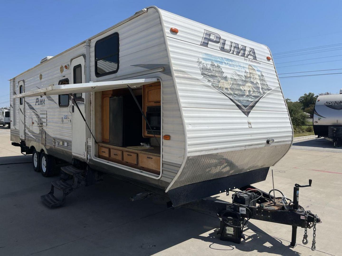 2012 WHITE PUMA 30KFB (4X4TPUF27CP) , Length: 34.75 ft. | Dry Weight: 8,130 lbs. | Gross Weight: 11,315 lbs. | Slides: 2 transmission, located at 4319 N Main St, Cleburne, TX, 76033, (817) 678-5133, 32.385960, -97.391212 - The 2012 Puma 30KFB travel trailer has 34.75 ft length, 8 ft width, 11.08 ft height, and 6.67 ft interior height. The dry weight of this unit is about 8,130 lbs, with a payload capacity of 3,125 lbs. It has a GVWR of 11,315 lbs and a hitch weight of 1,155 lbs. This unit highlights an outdoor fro - Photo#21