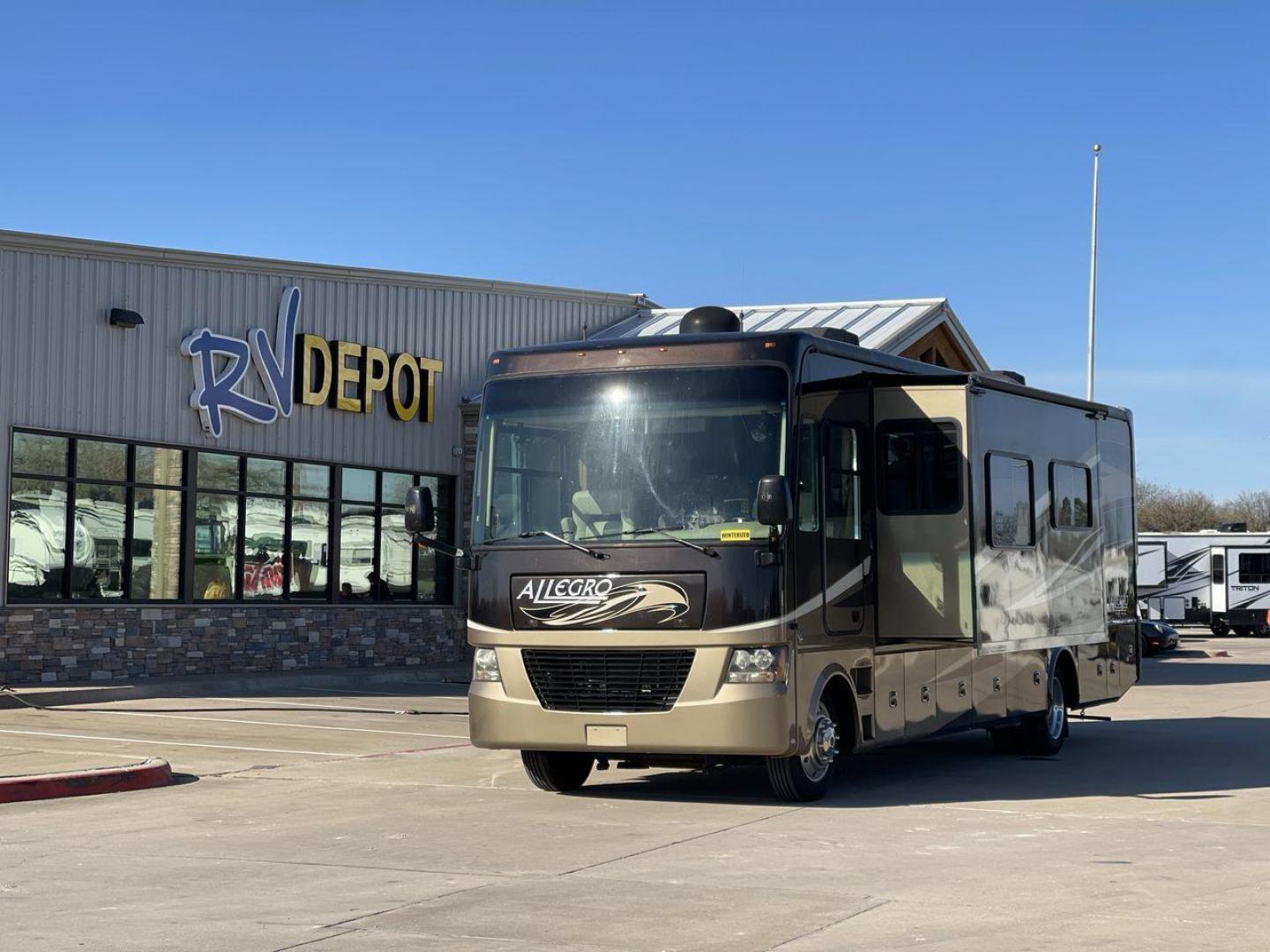 2012 TIFFIN ALLEGRO 34TGA (1F66F5DY6C0) , Length: 34.83 ft | Gross Weight: 22,000 lbs | Slides: 3 transmission, located at 4319 N Main St, Cleburne, TX, 76033, (817) 678-5133, 32.385960, -97.391212 - The 2012 Tiffin Allegro 34TGA is a luxurious Class A motorhome that combines elegant design, high-quality construction, and premium features for travelers seeking comfort and style on the road. Known for its solid build and well-appointed amenities, the Allegro 34TGA is perfect for long road trips, - Photo#0