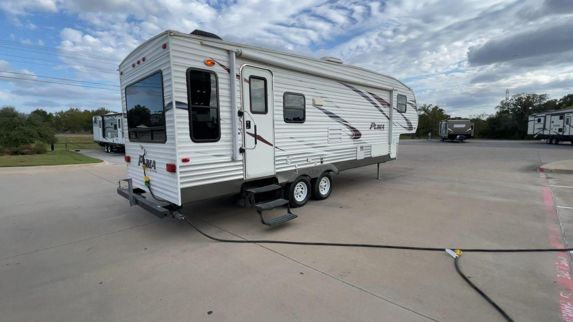 2013 FOREST RIVER PUMA 276RLSS (4X4FPAD29DP) , Length: 30.17 ft. | Dry Weight: 7,451 lbs. | Gross Weight: 10,273 lbs. | Slides: 1 transmission, located at 4319 N Main St, Cleburne, TX, 76033, (817) 678-5133, 32.385960, -97.391212 - The 2013 Forest River Puma 276RLSS, measuring 30.17 feet in length, has a dry weight of 7,451 pounds and a gross weight of 10,273 pounds. These specs automatically make it a durable and versatile fifth wheel. This unit features a single slideout, which expands the living space. The exterior design i - Photo#1