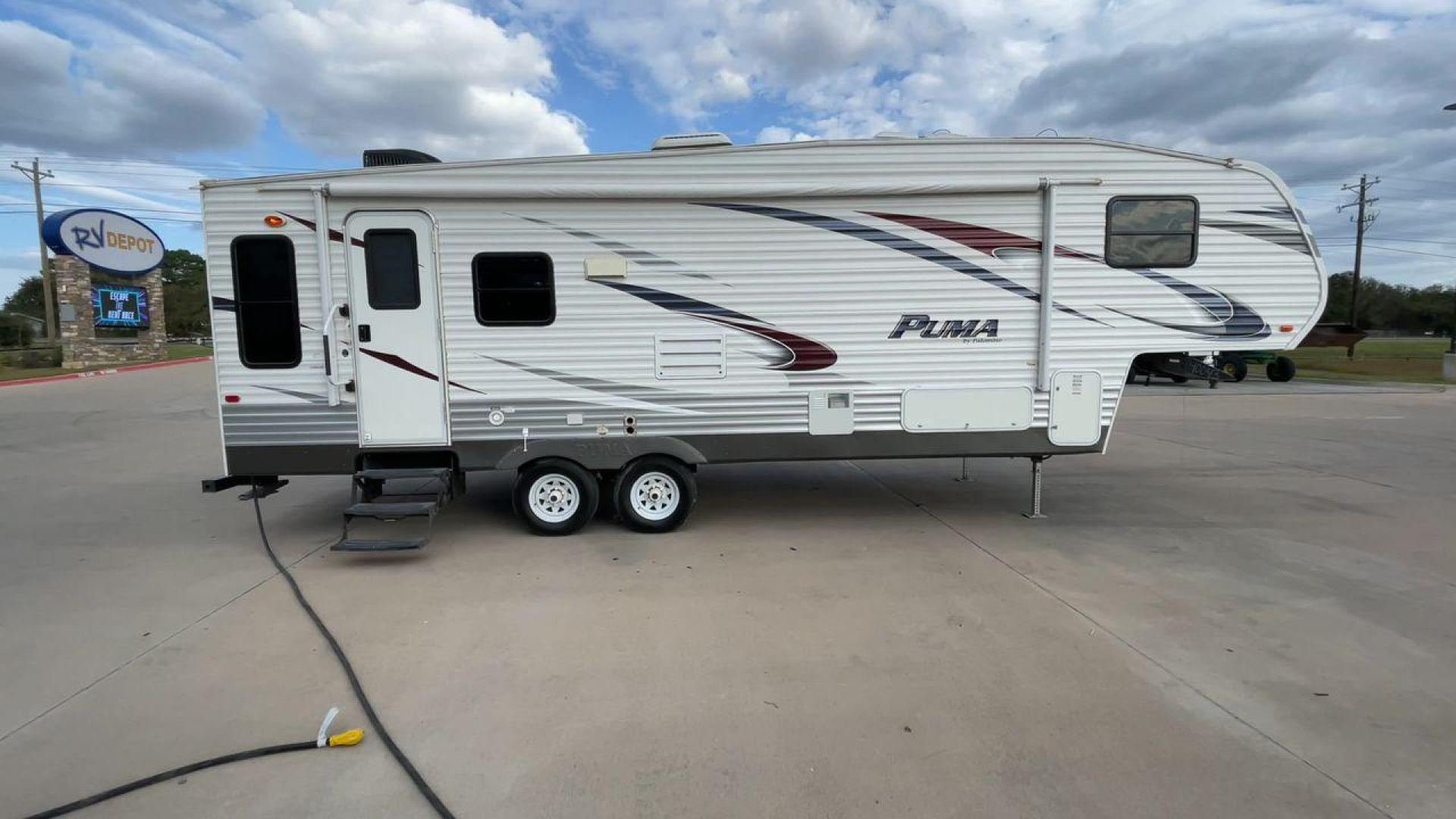 2013 FOREST RIVER PUMA 276RLSS (4X4FPAD29DP) , Length: 30.17 ft. | Dry Weight: 7,451 lbs. | Gross Weight: 10,273 lbs. | Slides: 1 transmission, located at 4319 N Main St, Cleburne, TX, 76033, (817) 678-5133, 32.385960, -97.391212 - The 2013 Forest River Puma 276RLSS, measuring 30.17 feet in length, has a dry weight of 7,451 pounds and a gross weight of 10,273 pounds. These specs automatically make it a durable and versatile fifth wheel. This unit features a single slideout, which expands the living space. The exterior design i - Photo#2