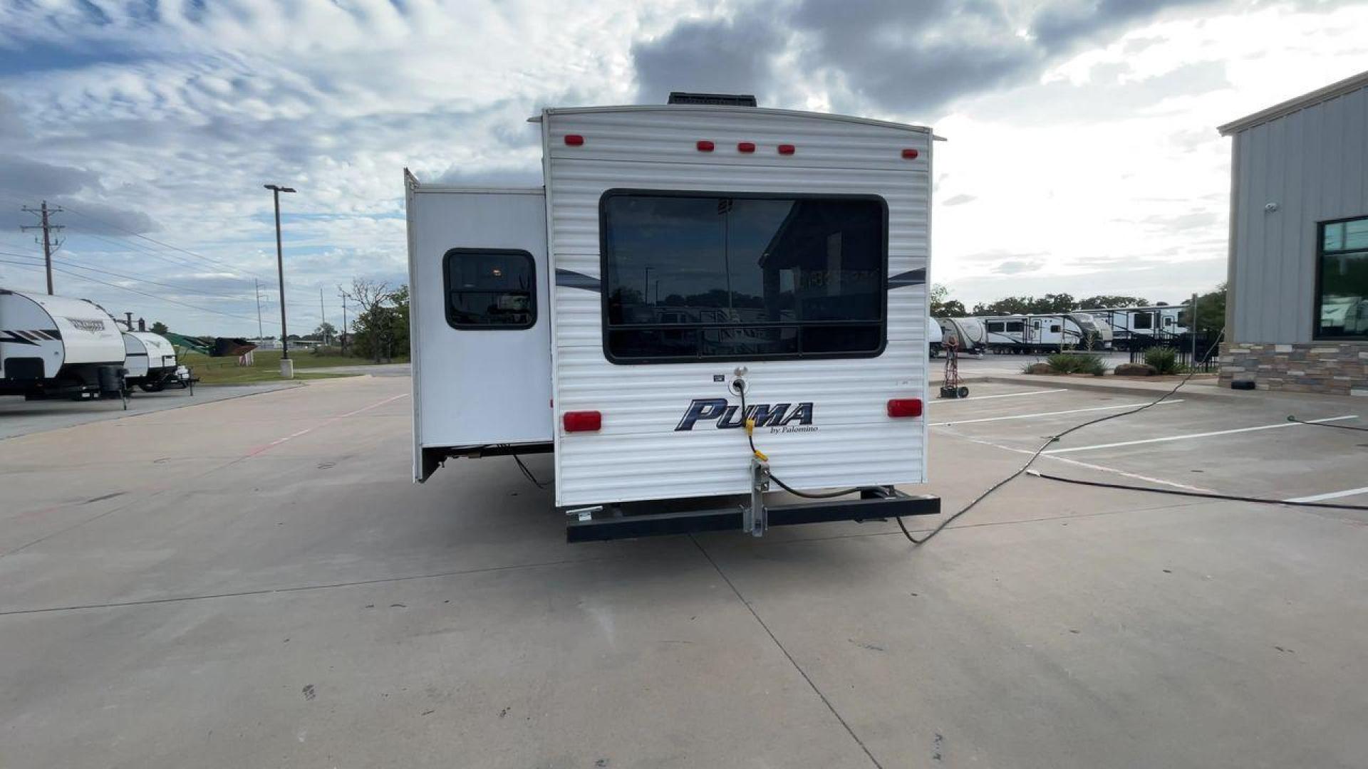 2013 FOREST RIVER PUMA 276RLSS (4X4FPAD29DP) , Length: 30.17 ft. | Dry Weight: 7,451 lbs. | Gross Weight: 10,273 lbs. | Slides: 1 transmission, located at 4319 N Main St, Cleburne, TX, 76033, (817) 678-5133, 32.385960, -97.391212 - The 2013 Forest River Puma 276RLSS, measuring 30.17 feet in length, has a dry weight of 7,451 pounds and a gross weight of 10,273 pounds. These specs automatically make it a durable and versatile fifth wheel. This unit features a single slideout, which expands the living space. The exterior design i - Photo#8