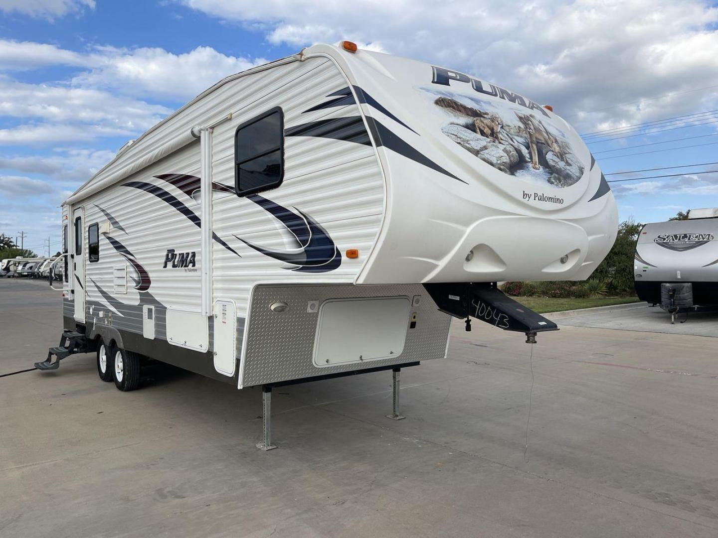 2013 FOREST RIVER PUMA 276RLSS (4X4FPAD29DP) , Length: 30.17 ft. | Dry Weight: 7,451 lbs. | Gross Weight: 10,273 lbs. | Slides: 1 transmission, located at 4319 N Main St, Cleburne, TX, 76033, (817) 678-5133, 32.385960, -97.391212 - The 2013 Forest River Puma 276RLSS, measuring 30.17 feet in length, has a dry weight of 7,451 pounds and a gross weight of 10,273 pounds. These specs automatically make it a durable and versatile fifth wheel. This unit features a single slideout, which expands the living space. The exterior design i - Photo#23