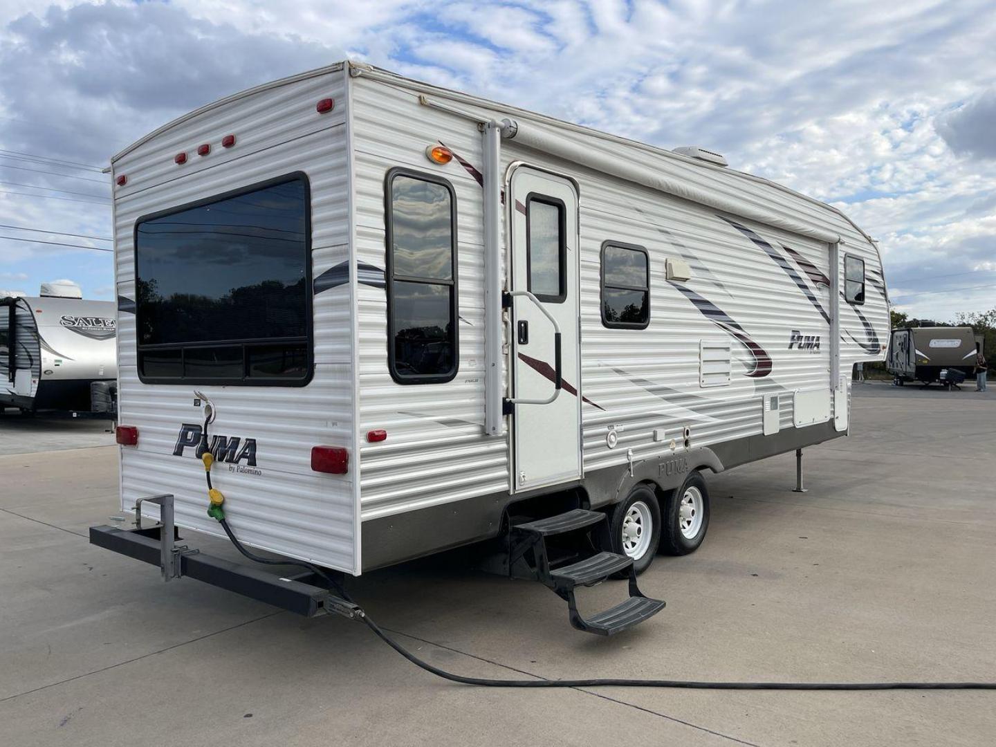 2013 FOREST RIVER PUMA 276RLSS (4X4FPAD29DP) , Length: 30.17 ft. | Dry Weight: 7,451 lbs. | Gross Weight: 10,273 lbs. | Slides: 1 transmission, located at 4319 N Main St, Cleburne, TX, 76033, (817) 678-5133, 32.385960, -97.391212 - The 2013 Forest River Puma 276RLSS, measuring 30.17 feet in length, has a dry weight of 7,451 pounds and a gross weight of 10,273 pounds. These specs automatically make it a durable and versatile fifth wheel. This unit features a single slideout, which expands the living space. The exterior design i - Photo#25