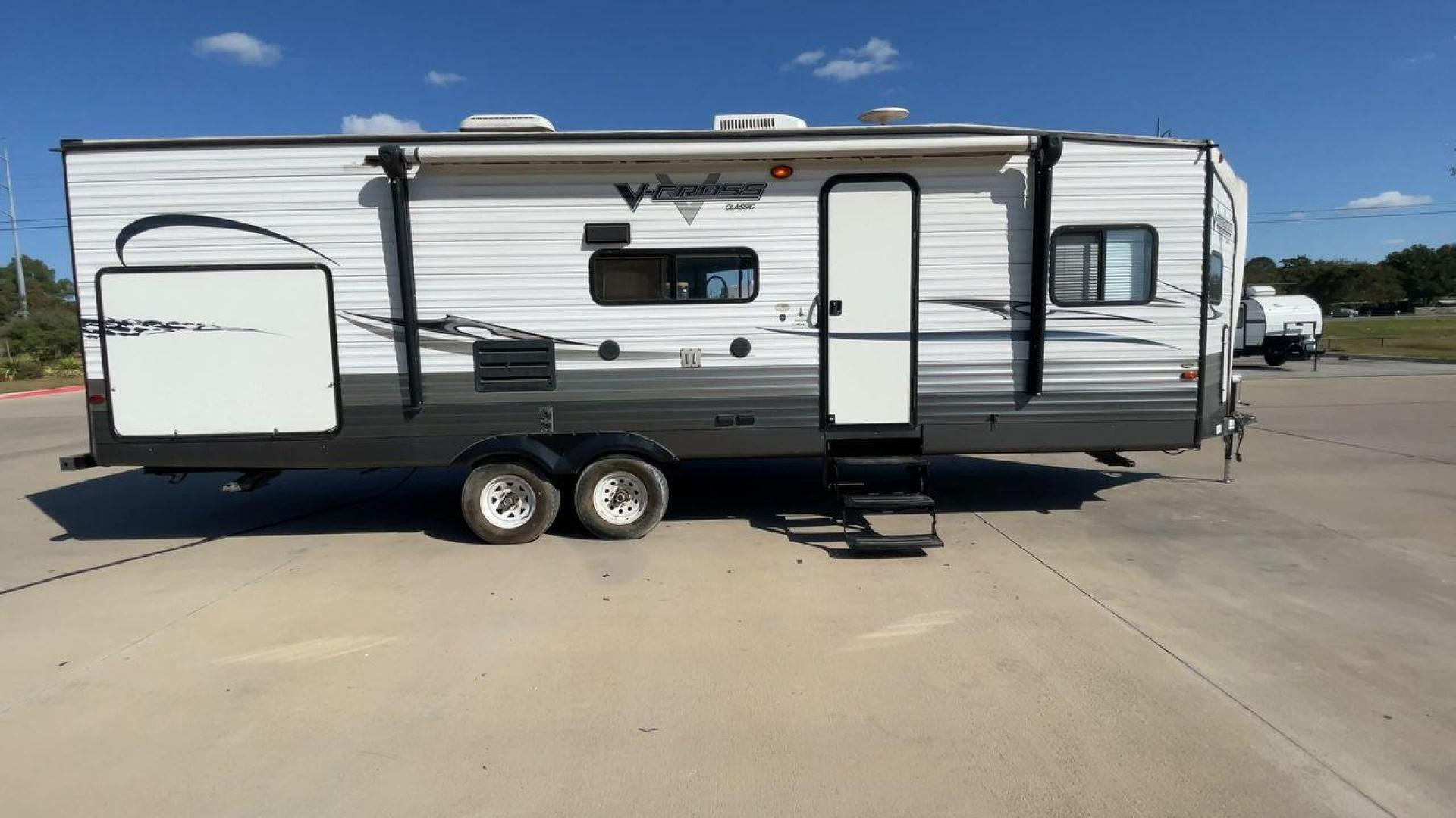 2013 WHITE FOREST RIVER VCROSS 28VRBK (4X4TVCD28DX) , Length: 32.17 ft. | Dry Weight: 7,538 lbs. | Gross Weight: 9,985 lbs. | Slides: 1 transmission, located at 4319 N Main St, Cleburne, TX, 76033, (817) 678-5133, 32.385960, -97.391212 - The 2013 Forest River V-Cross 28VRBK is a dual-axle steel wheel set-up that measures just a little over 32 ft. in length. It has a dry weight of 7,538 lbs. and a GVWR of 9,985 lbs. It is equipped with 1 power slide. It also comes with automatic heating and cooling rated at 30,000 and 13,500 BTUs res - Photo#2