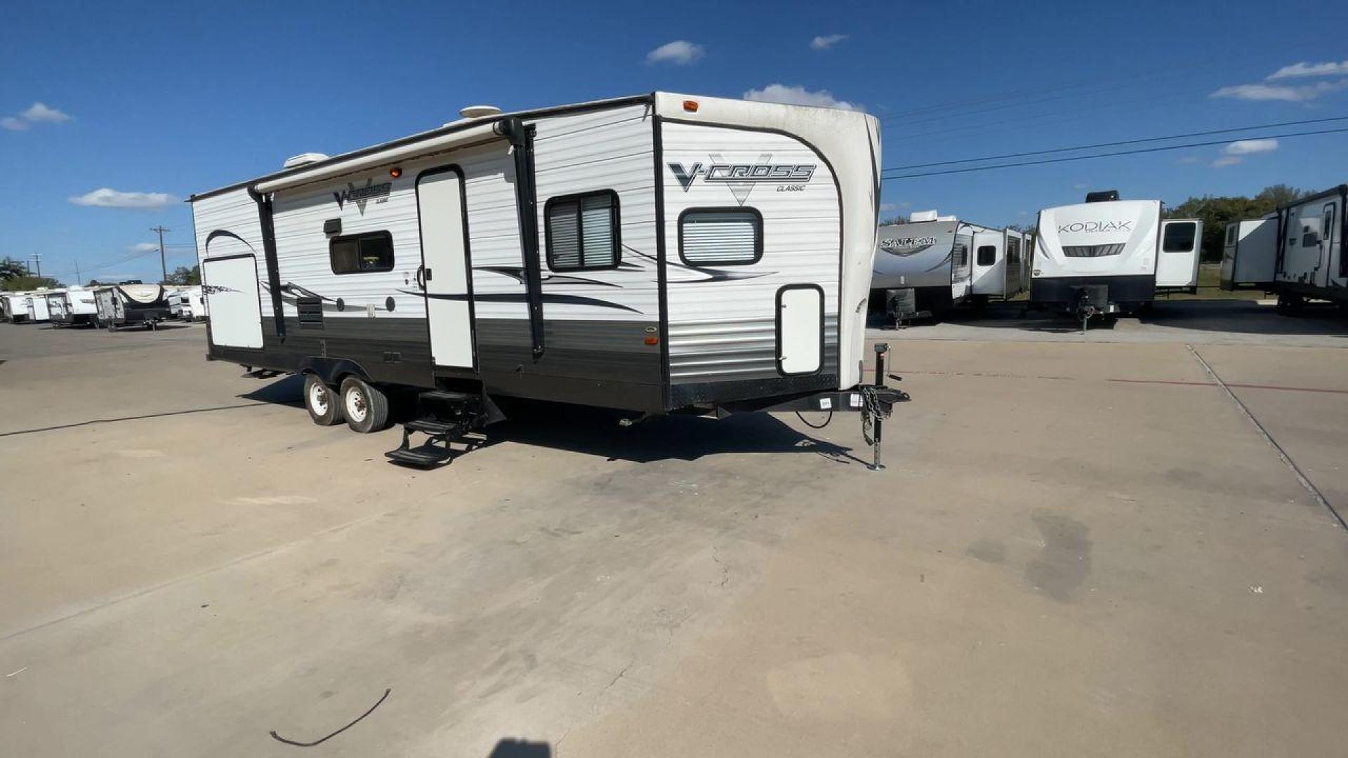 2013 WHITE FOREST RIVER VCROSS 28VRBK (4X4TVCD28DX) , Length: 32.17 ft. | Dry Weight: 7,538 lbs. | Gross Weight: 9,985 lbs. | Slides: 1 transmission, located at 4319 N Main St, Cleburne, TX, 76033, (817) 678-5133, 32.385960, -97.391212 - The 2013 Forest River V-Cross 28VRBK is a dual-axle steel wheel set-up that measures just a little over 32 ft. in length. It has a dry weight of 7,538 lbs. and a GVWR of 9,985 lbs. It is equipped with 1 power slide. It also comes with automatic heating and cooling rated at 30,000 and 13,500 BTUs res - Photo#3