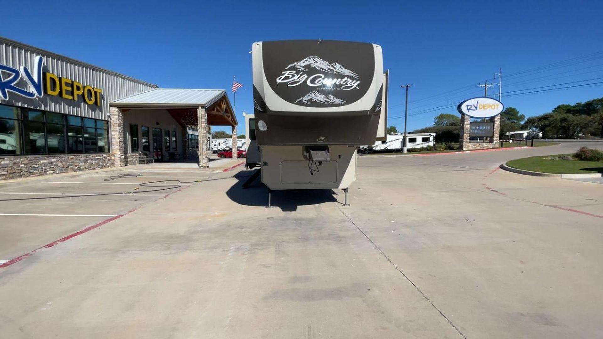 2013 HEARTLAND BIG COUNTRY 3251TS (5SFBG3423DE) , Length: 37.92 ft. | Dry Weight: 10,999 lbs. | Gross Weight: 14,000 lbs. | Slides: 3 transmission, located at 4319 N Main St, Cleburne, TX, 76033, (817) 678-5133, 32.385960, -97.391212 - This 2013 Heartland Big Country 3251TS fifth wheel measures 37.92 feet. There are two axles with aluminum wheels and hydraulic drum brakes. Its dry weight is 10,999 lbs; its payload is 3,410 lbs, its hitch is 1,920 lbs and the GVWR 14,000 lbs. The fiberglass walls are painted tan with gray and blue - Photo#4