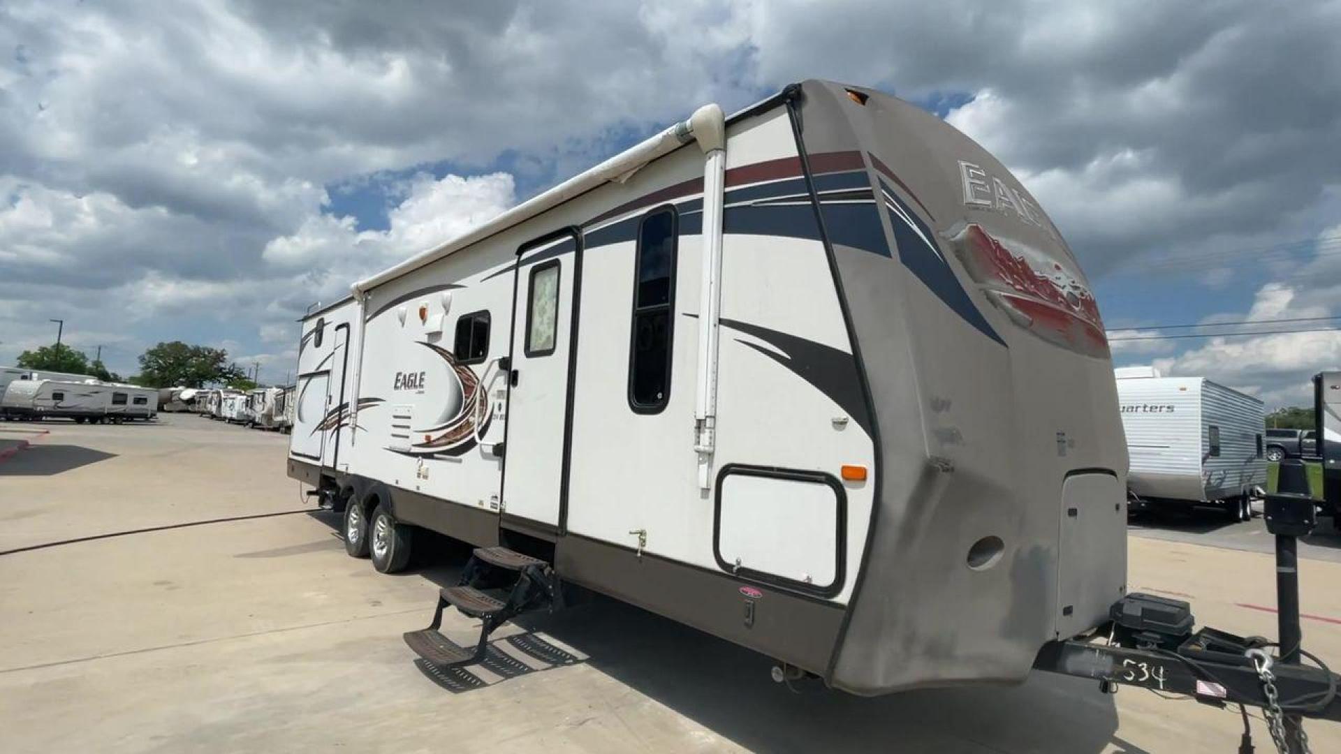 2013 JAYCO EAGLE 314BDS (1UJBJ0BSXD1) , Length: 32.58 ft. | Dry Weight: 7,465 lbs. | Gross Weight: 9,975 lbs. | Slides: 2 transmission, located at 4319 N Main St, Cleburne, TX, 76033, (817) 678-5133, 32.385960, -97.391212 - The 2013 Jayco Eagle 314BDS is a robust and spacious travel trailer designed to deliver a comfortable and enjoyable camping experience for families and groups. It stretches 32.58 feet in length and boasts a dry weight of 7,465 pounds, making it a solid choice for those looking to tow a substantial y - Photo#3