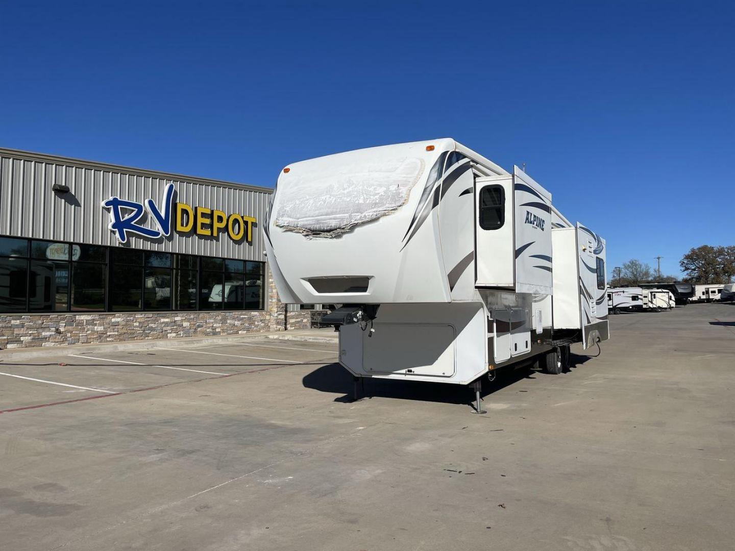 2013 WHITE KEYSTONE ALPINE 3250RL - (4YDF3252XDE) , Length: 36.92 ft. | Dry Weight: 11,715 lbs. | Gross Weight: 15,060 lbs. | Slides: 4 transmission, located at 4319 N Main St, Cleburne, TX, 76033, (817) 678-5133, 32.385960, -97.391212 - With a length of 37 feet, this RV is thoughtfully designed to provide accommodation for up to four individuals, offering an intimate and comfortable space for your travels. The interior features expansive and elegantly appointed living spaces, boasting high-quality furnishings and finishes. A gourme - Photo#0