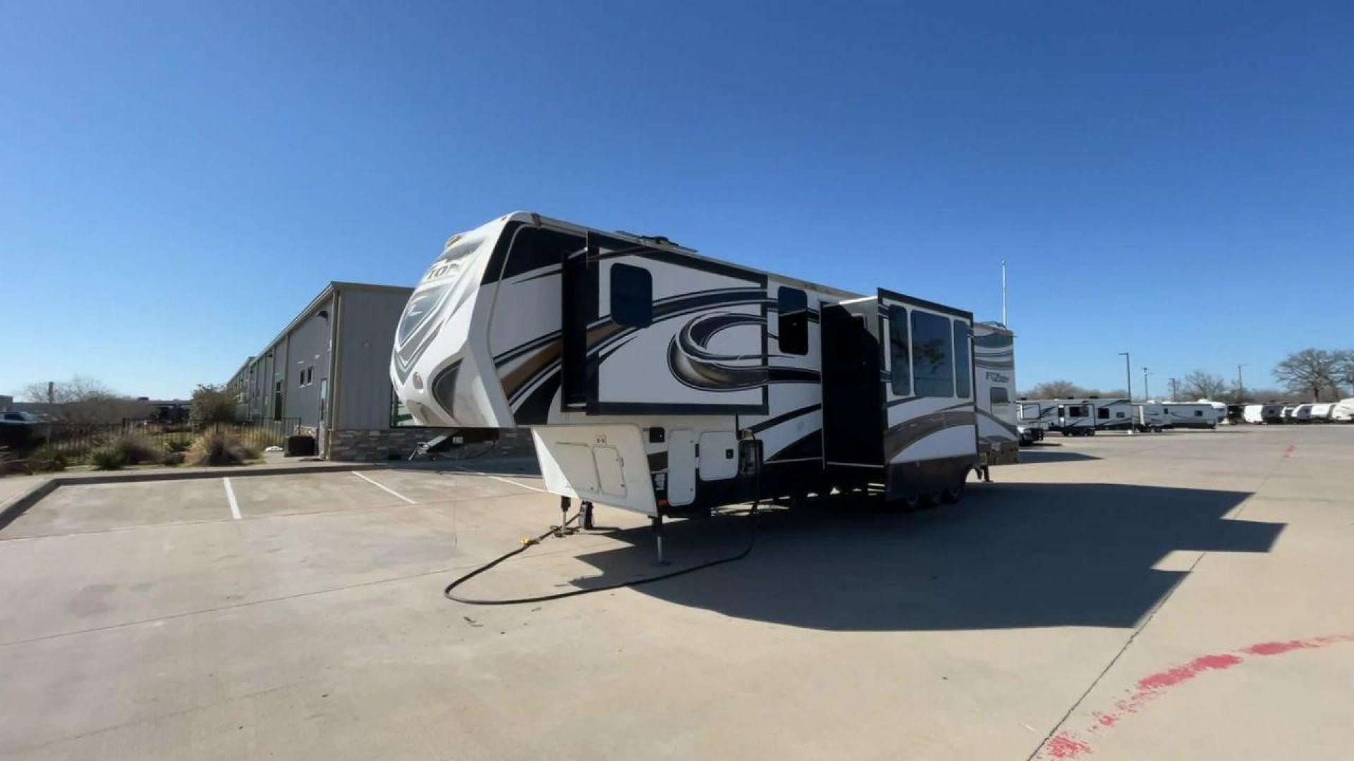 2013 WHITE KEYSTONE FUZION FZ399 - (4YDF39923DF) , Length: 41 ft. | Dry Weight: 13,880 lbs. | Gross Weight: 18,000 lbs. | Slides: 3 transmission, located at 4319 N Main St, Cleburne, TX, 76033, (817) 678-5133, 32.385960, -97.391212 - The 2013 Keystone Fuzion FZ399 toy hauler measures 41 ft in length, 8.5 ft in width, and 13.25 ft in height. It has a dry weight of 13,880 lbs with a payload capacity of 4,120 lbs. The GVWR is 18,000 lbs and has a hitch weight of 3,560 lbs. This has a triple axle and triple slide with one 20 ft powe - Photo#5