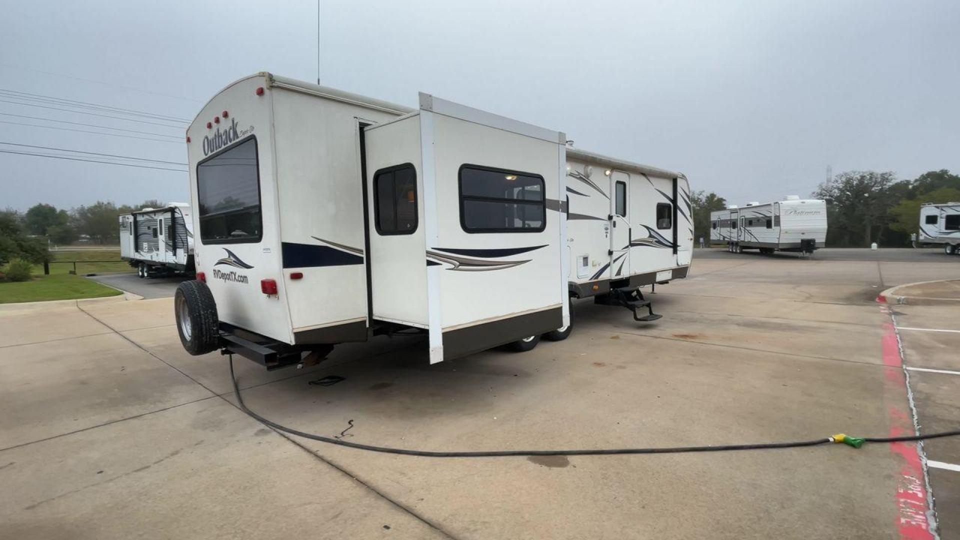 2013 KEYSTONE RV OUTBACK 298RE (4YDT29827DB) , Length: 35.17 ft.| Dry Weight: 7,443 lbs. | Gross Weight: 9,000 lbs. | Slides: 1 transmission, located at 4319 N Main St, Cleburne, TX, 76033, (817) 678-5133, 32.385960, -97.391212 - The 2013 Keystone RV Outback 298RE is an ideal camping trailer for a family that sets out to the great outdoors every week. This unit has measurements of 35.17 ft in length, 8 ft in width, and 10.92 ft in height. The dry weight is about 7,443 lbs with a payload capacity of 1,557 lbs. It has a GV - Photo#1