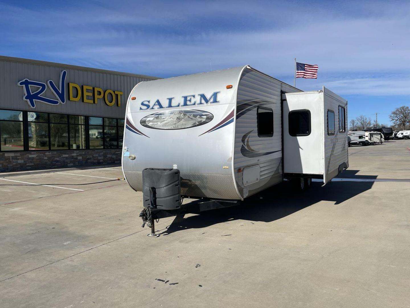 2013 GRAY SALEM 27DBUD - (4X4TSMC22DA) , Length: 29.5 ft. | Dry Weight: 6,164 lbs. | Slides: 1 transmission, located at 4319 N Main St, Cleburne, TX, 76033, (817) 678-5133, 32.385960, -97.391212 - This 2013 Salem 27DBUD travel trailer is slightly about 30' long. It is a two-axle configuration. This camper has one slide and is quite comfy! The Salem's exterior is built of metal and painted white with gray markings. The kitchen is L-shaped. There is a matching refrigerator, oven/stove, and micr - Photo#0