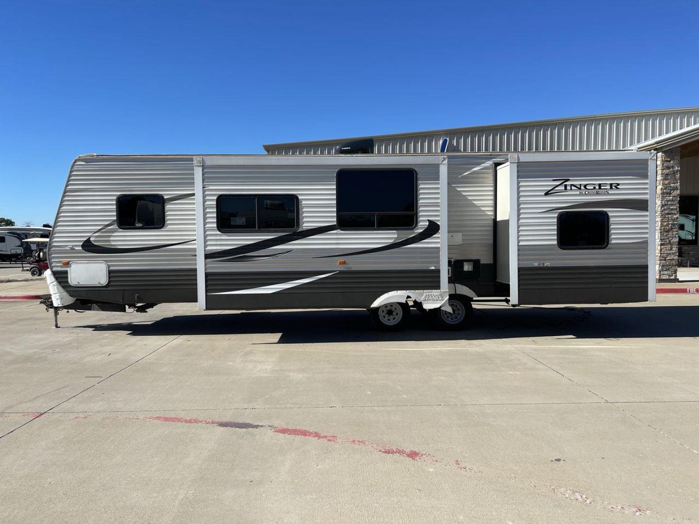 2013 WHITE ZINGER 31SB (4V0TC3129DJ) , Length: 35.5 ft. | Dry Weight: 7,875 lbs. | Gross Weight: 9,671 lbs. | Slides: 2 transmission, located at 4319 N Main St, Cleburne, TX, 76033, (817) 678-5133, 32.385960, -97.391212 - This 2013 Zinger 31SB is a dual-axle steel wheel setup measuring 35.5 ft. long and 11.42 ft. tall. It has a dry weight of 7,875 lbs. and a GVWR of 9,671 lbs. It is designed with two doors, two slides, and one awning. The interior features two bedrooms, a bathroom, a kitchen, and a living area. The f - Photo#23