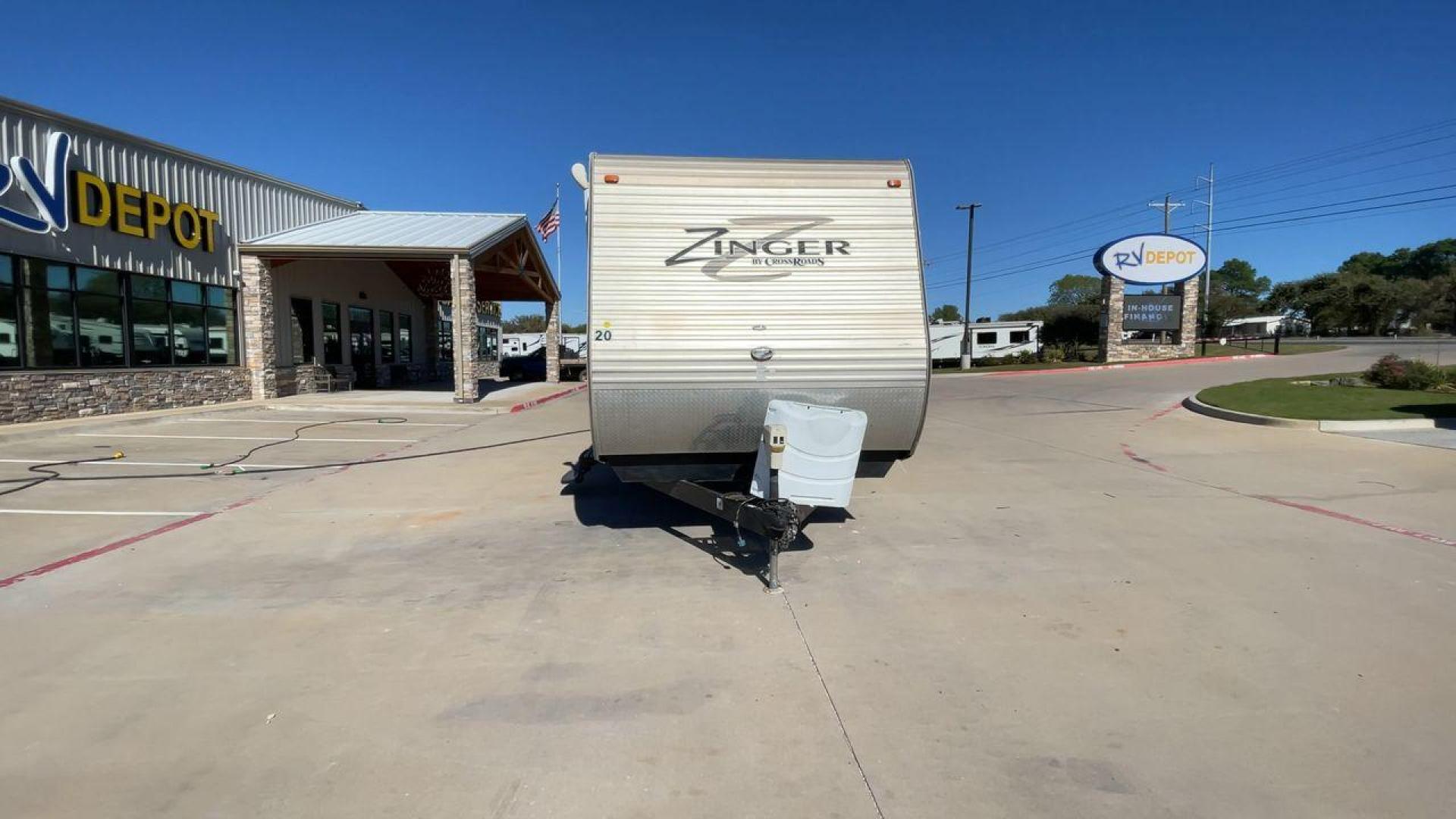 2013 WHITE ZINGER 31SB (4V0TC3129DJ) , Length: 35.5 ft. | Dry Weight: 7,875 lbs. | Gross Weight: 9,671 lbs. | Slides: 2 transmission, located at 4319 N Main St, Cleburne, TX, 76033, (817) 678-5133, 32.385960, -97.391212 - This 2013 Zinger 31SB is a dual-axle steel wheel setup measuring 35.5 ft. long and 11.42 ft. tall. It has a dry weight of 7,875 lbs. and a GVWR of 9,671 lbs. It is designed with two doors, two slides, and one awning. The interior features two bedrooms, a bathroom, a kitchen, and a living area. The f - Photo#4