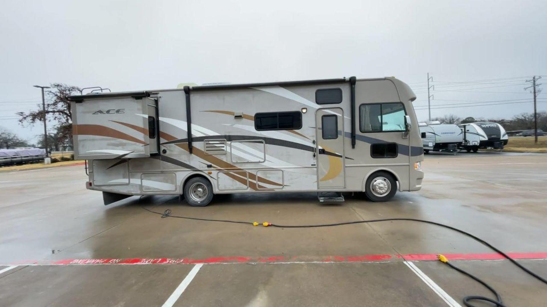 2014 TAN ACE 30.1 - (1F65F5DY8E0) , Length: 30.83 ft. | Gross Weight: 18,000 lbs. | Slides: 2 transmission, located at 4319 N Main St, Cleburne, TX, 76033, (817) 678-5133, 32.385960, -97.391212 - The 2014 ACE 30.1 is a Class A motorhome that is big and flexible, making it great for your next trip. This motorhome is the right size for getting around and is very comfortable. It is 30.83 feet long and weighs 18,000 pounds. The ACE 30.1 has two slides and a large 14-foot awning, so it has a lot - Photo#2