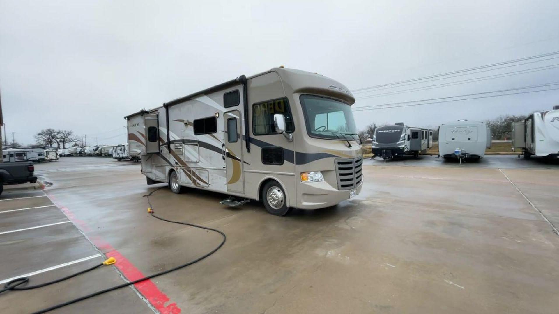 2014 TAN ACE 30.1 - (1F65F5DY8E0) , Length: 30.83 ft. | Gross Weight: 18,000 lbs. | Slides: 2 transmission, located at 4319 N Main St, Cleburne, TX, 76033, (817) 678-5133, 32.385960, -97.391212 - The 2014 ACE 30.1 is a Class A motorhome that is big and flexible, making it great for your next trip. This motorhome is the right size for getting around and is very comfortable. It is 30.83 feet long and weighs 18,000 pounds. The ACE 30.1 has two slides and a large 14-foot awning, so it has a lot - Photo#3