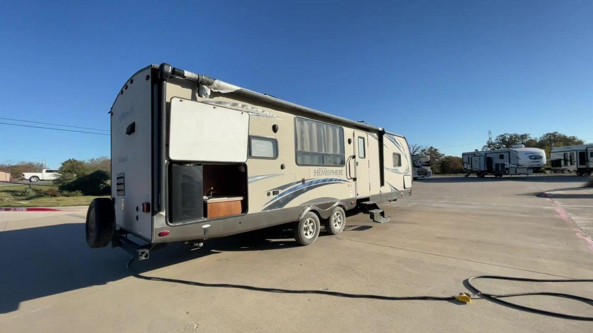 2014 TAN FOREST RIVER HEMISPHERE 282RK (4X4TSBD2XEU) , Length: 35 ft. | Dry Weight: 6,620 lbs | Gross Weight: 8,521 lbs. | Slides: 1 transmission, located at 4319 N Main St, Cleburne, TX, 76033, (817) 678-5133, 32.385960, -97.391212 - The 2014 Forest River Hemisphere 282RK is a great travel trailer that is made to make your outdoor activities more comfortable and easy. This 35-foot trailer has a dry weight of 6,620 pounds and a gross weight of 8,521 pounds, making it easy to tow and providing plenty of space for all your gear. Th - Photo#1