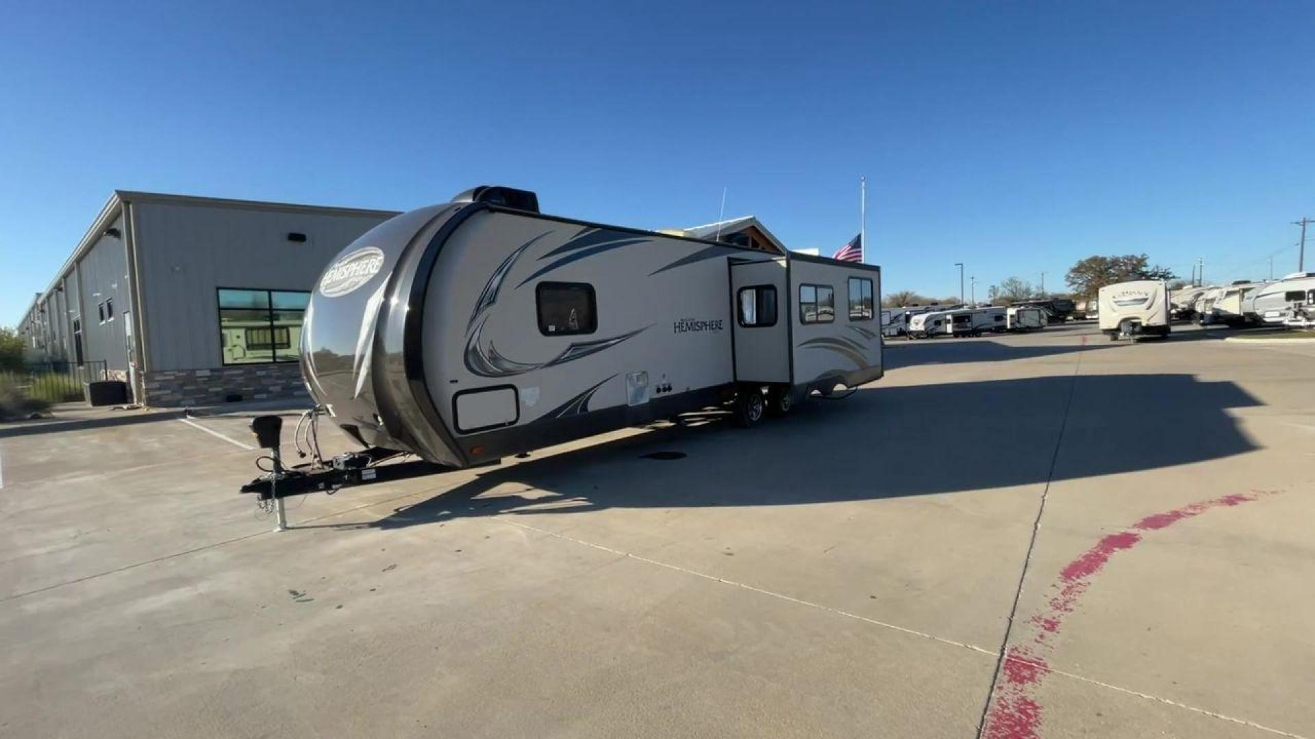 2014 TAN FOREST RIVER HEMISPHERE 282RK (4X4TSBD2XEU) , Length: 35 ft. | Dry Weight: 6,620 lbs | Gross Weight: 8,521 lbs. | Slides: 1 transmission, located at 4319 N Main St, Cleburne, TX, 76033, (817) 678-5133, 32.385960, -97.391212 - The 2014 Forest River Hemisphere 282RK is a great travel trailer that is made to make your outdoor activities more comfortable and easy. This 35-foot trailer has a dry weight of 6,620 pounds and a gross weight of 8,521 pounds, making it easy to tow and providing plenty of space for all your gear. Th - Photo#5