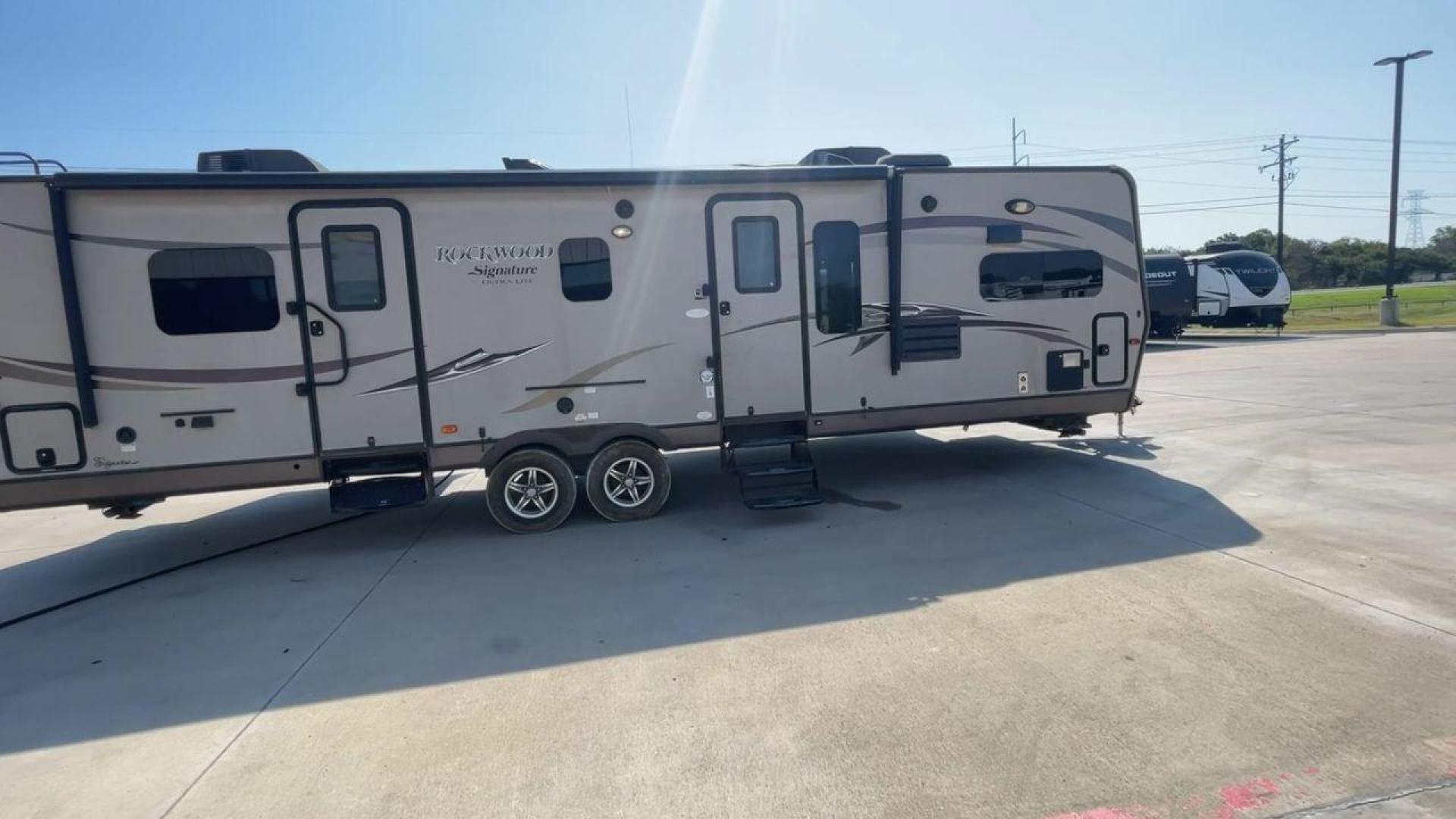 2014 WHITE FOREST RIVER ROCKWOOD 8315BBS (4X4TRLG29E1) , Length: 34.75 ft. | Dry Weight: 6,843 lbs.| Slides: 2 transmission, located at 4319 N Main St, Cleburne, TX, 76033, (817) 678-5133, 32.385960, -97.391212 - Are you looking for a camper to accommodate the whole family and invite a few of your friends? Then the 2014 Forest River Rockwood 8315BBS travel trailer is an ideal pick for you! This camper measures just 34.75 ft in length, 8 ft in width, 9.83 ft in height, and 6.67 ft in interior height. It has a - Photo#2