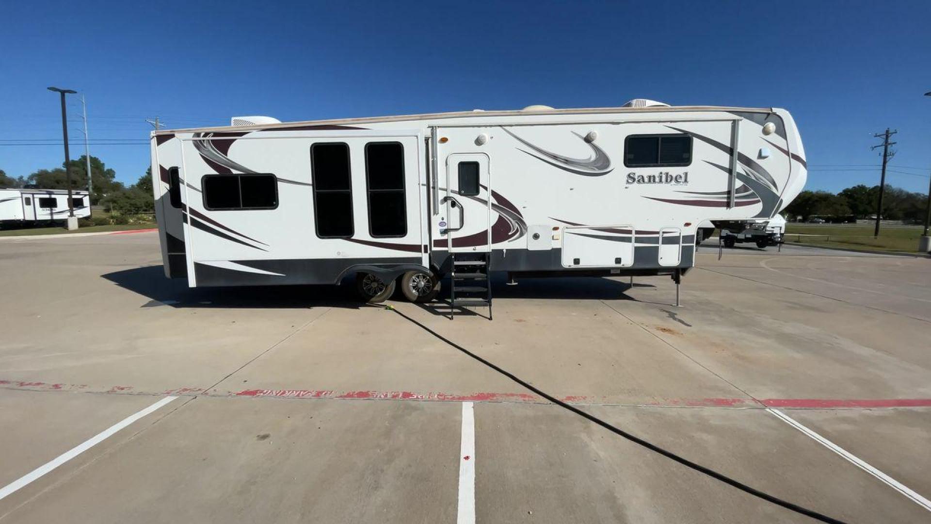 2014 WHITE FOREST RIVER SANIBEL 3600 (5ZT3SN1B8EG) , Length: 40.17 ft. | Dry Weight: 12,640 lbs. | Slides: 3 transmission, located at 4319 N Main St, Cleburne, TX, 76033, (817) 678-5133, 32.385960, -97.391212 - The 2014 Forest River Sanibel 3600 is a dual-axle aluminum wheel set-up measuring 40.17 ft. in length. It has a dry weight of 12,640 lbs. with a payload capacity of 2,801 lbs. It is made of aluminum and fiberglass. It comes equipped with 3 power-retractable slides and a whole 18-foot power-retractab - Photo#2