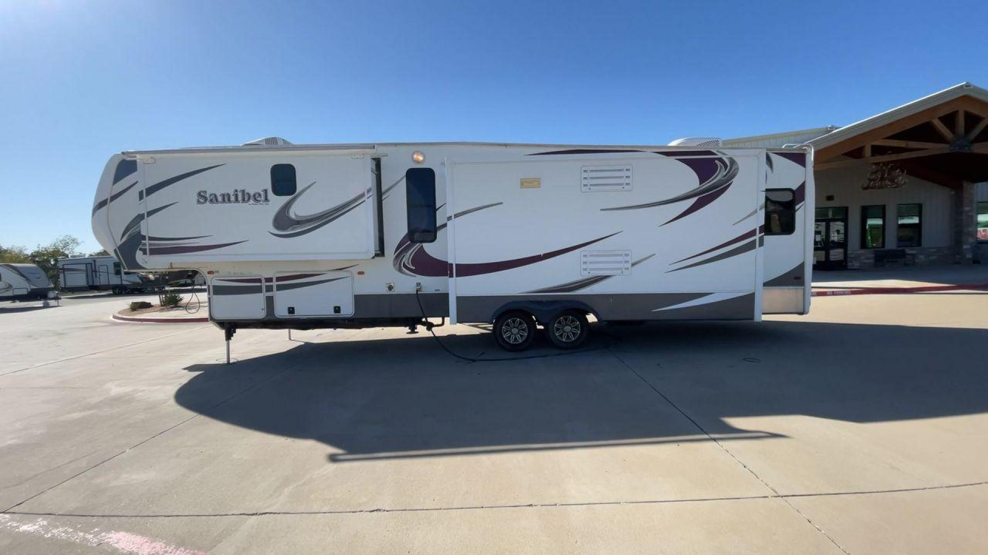 2014 WHITE FOREST RIVER SANIBEL 3600 (5ZT3SN1B8EG) , Length: 40.17 ft. | Dry Weight: 12,640 lbs. | Slides: 3 transmission, located at 4319 N Main St, Cleburne, TX, 76033, (817) 678-5133, 32.385960, -97.391212 - The 2014 Forest River Sanibel 3600 is a dual-axle aluminum wheel set-up measuring 40.17 ft. in length. It has a dry weight of 12,640 lbs. with a payload capacity of 2,801 lbs. It is made of aluminum and fiberglass. It comes equipped with 3 power-retractable slides and a whole 18-foot power-retractab - Photo#6