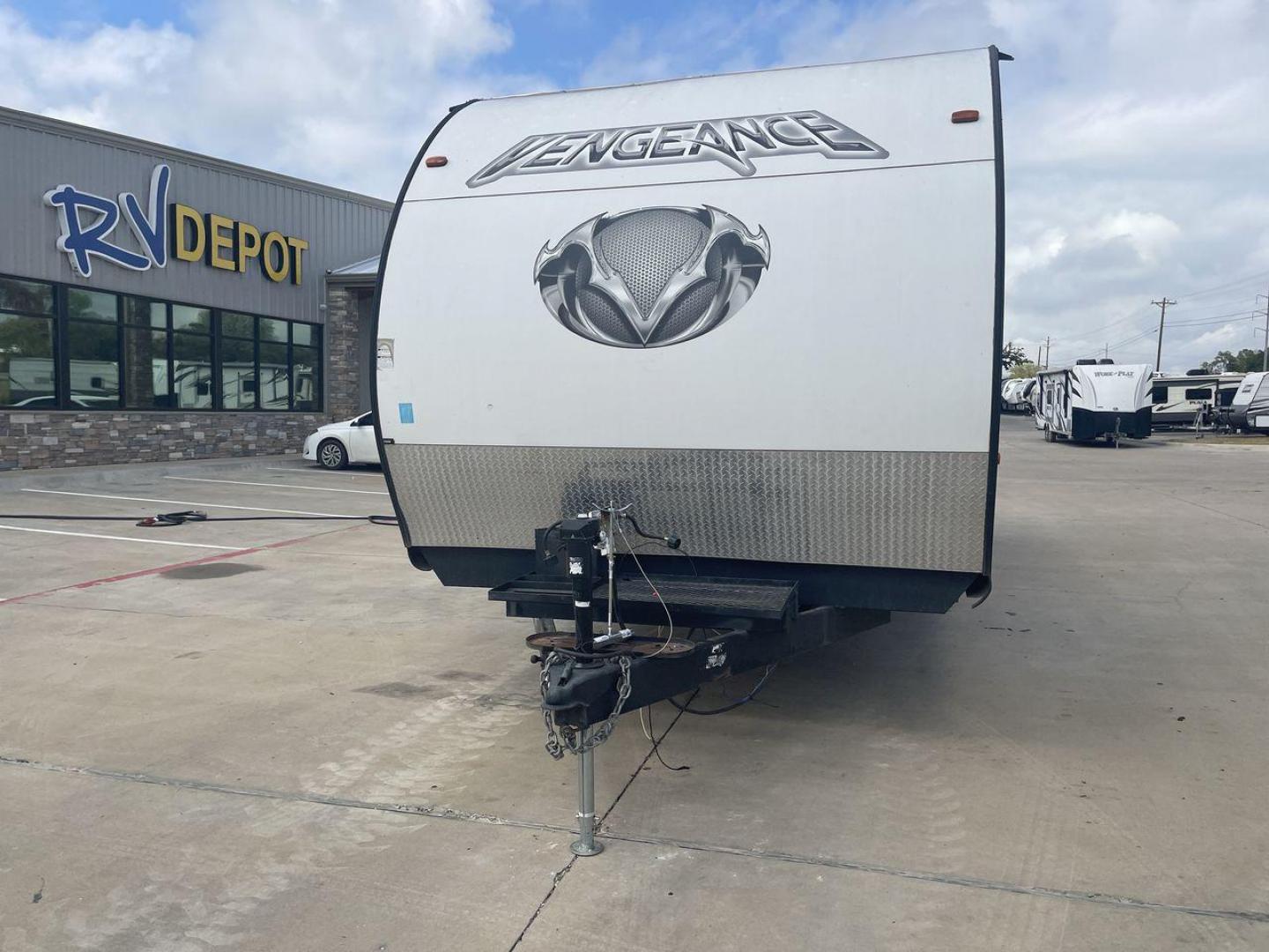 2014 WHITE FOREST RIVER VENGEANCE 25V - (4X4TVGA25EX) , Length: 30.5 ft. | Dry Weight: 6,366 lbs. | Gross Weight: 9,985 lbs. | Slides: 0 transmission, located at 4319 N Main St, Cleburne, TX, 76033, (817) 678-5133, 32.385960, -97.391212 - The 2014 Forest River Vengeance 25V is a tough and roomy travel trailer made for people who love the outdoors and want to be comfortable and easy on their trips. This trailer provides generous living space and is conveniently lightweight, making it a breeze to tow. With its compact size, the Vengean - Photo#0