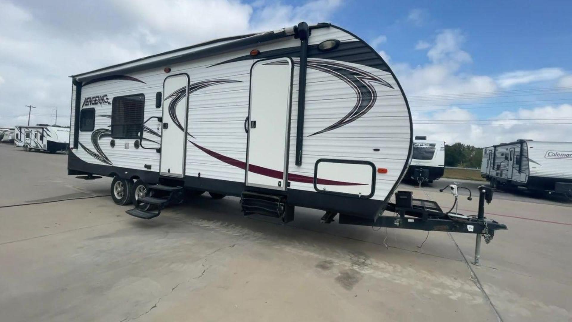 2014 WHITE FOREST RIVER VENGEANCE 25V - (4X4TVGA25EX) , Length: 30.5 ft. | Dry Weight: 6,366 lbs. | Gross Weight: 9,985 lbs. | Slides: 0 transmission, located at 4319 N Main St, Cleburne, TX, 76033, (817) 678-5133, 32.385960, -97.391212 - The 2014 Forest River Vengeance 25V is a tough and roomy travel trailer made for people who love the outdoors and want to be comfortable and easy on their trips. This trailer provides generous living space and is conveniently lightweight, making it a breeze to tow. With its compact size, the Vengean - Photo#3