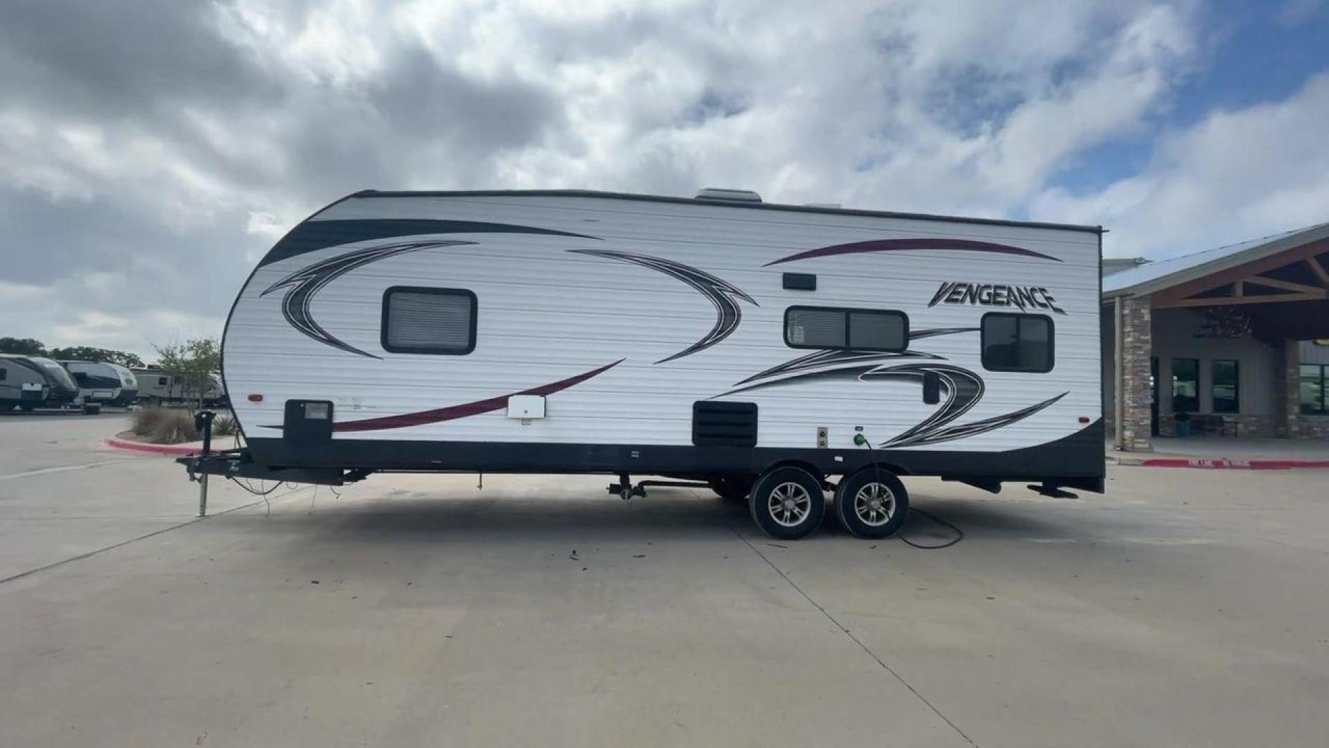 2014 WHITE FOREST RIVER VENGEANCE 25V - (4X4TVGA25EX) , Length: 30.5 ft. | Dry Weight: 6,366 lbs. | Gross Weight: 9,985 lbs. | Slides: 0 transmission, located at 4319 N Main St, Cleburne, TX, 76033, (817) 678-5133, 32.385960, -97.391212 - The 2014 Forest River Vengeance 25V is a tough and roomy travel trailer made for people who love the outdoors and want to be comfortable and easy on their trips. This trailer provides generous living space and is conveniently lightweight, making it a breeze to tow. With its compact size, the Vengean - Photo#6