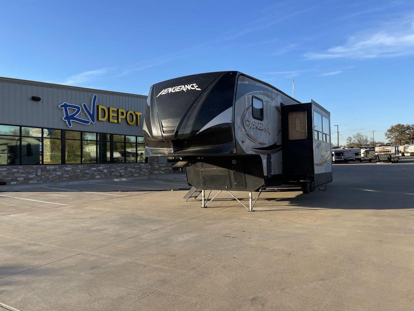 2014 WHITE FOREST RIVER VENGEANCE 312A (4X4FVGG22EY) , Length: 37.92 ft. | Dry Weight: 10,068 lbs. | Gross Weight: 14,508 lbs. | Slides: 1 transmission, located at 4319 N Main St, Cleburne, TX, 76033, (817) 678-5133, 32.385960, -97.391212 - This 2014 Vengeance Toy Hauler has a dry weight of 10,068 lbs and a GVWR of 14,508 lbs with a hitch weight of 2,508 lbs. This unit also has automatic heating and cooling for optimal temperature control. The exterior of this toy hauler is a simple cream base with black and red accents. This model als - Photo#0