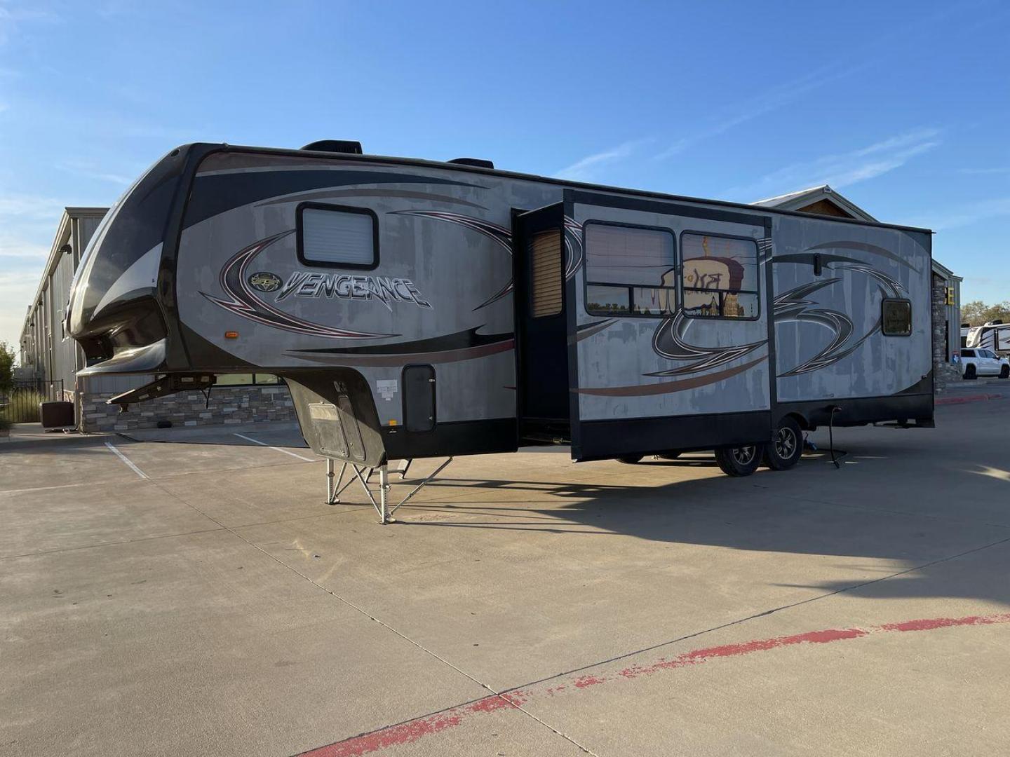 2014 WHITE FOREST RIVER VENGEANCE 312A (4X4FVGG22EY) , Length: 37.92 ft. | Dry Weight: 10,068 lbs. | Gross Weight: 14,508 lbs. | Slides: 1 transmission, located at 4319 N Main St, Cleburne, TX, 76033, (817) 678-5133, 32.385960, -97.391212 - This 2014 Vengeance Toy Hauler has a dry weight of 10,068 lbs and a GVWR of 14,508 lbs with a hitch weight of 2,508 lbs. This unit also has automatic heating and cooling for optimal temperature control. The exterior of this toy hauler is a simple cream base with black and red accents. This model als - Photo#22