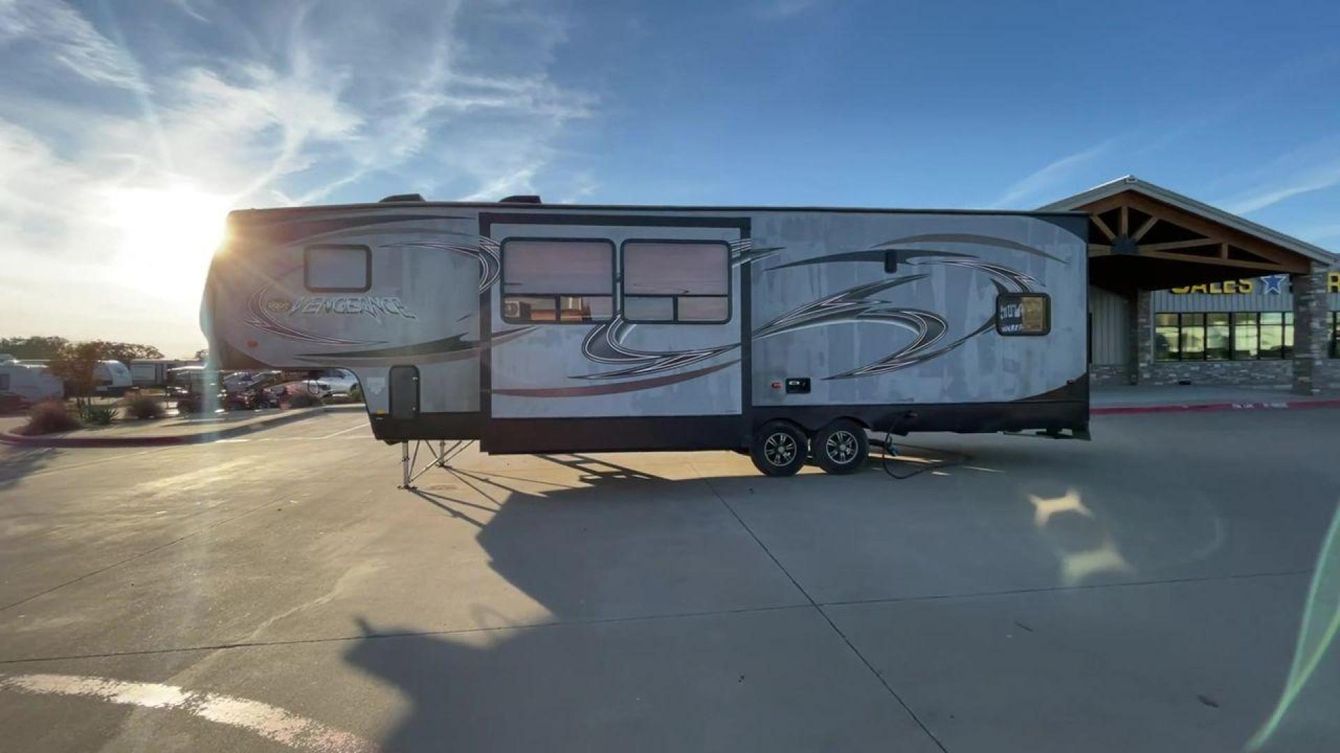 2014 WHITE FOREST RIVER VENGEANCE 312A (4X4FVGG22EY) , Length: 37.92 ft. | Dry Weight: 10,068 lbs. | Gross Weight: 14,508 lbs. | Slides: 1 transmission, located at 4319 N Main St, Cleburne, TX, 76033, (817) 678-5133, 32.385960, -97.391212 - This 2014 Vengeance Toy Hauler has a dry weight of 10,068 lbs and a GVWR of 14,508 lbs with a hitch weight of 2,508 lbs. This unit also has automatic heating and cooling for optimal temperature control. The exterior of this toy hauler is a simple cream base with black and red accents. This model als - Photo#6