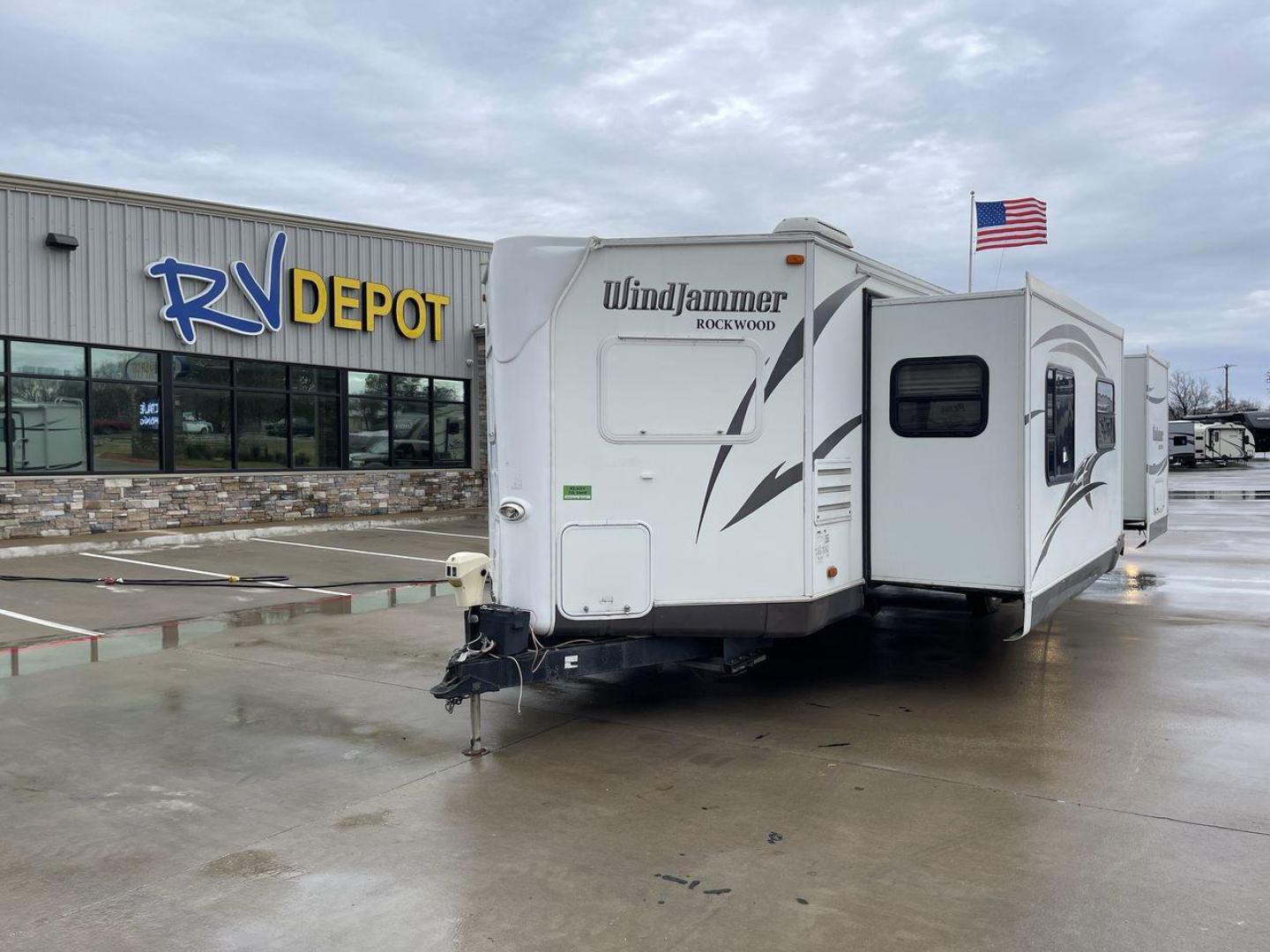 2014 WHITE FOREST RIVER WNDJMR 3008W (4X4TRLF20E1) , Length: 34.42 ft. | Dry Weight: 7,038 lbs. | Slides: 2 transmission, located at 4319 N Main St, Cleburne, TX, 76033, (817) 678-5133, 32.385960, -97.391212 - This 2014 Forest River WNDJMR 3008W travel trailer is painted in a stunning white exterior color, giving it a sleek and modern look. It embodies the perfect balance of comfort, functionality, and style, making it an ideal choice for both seasoned travelers and those embarking on their first RV adven - Photo#0