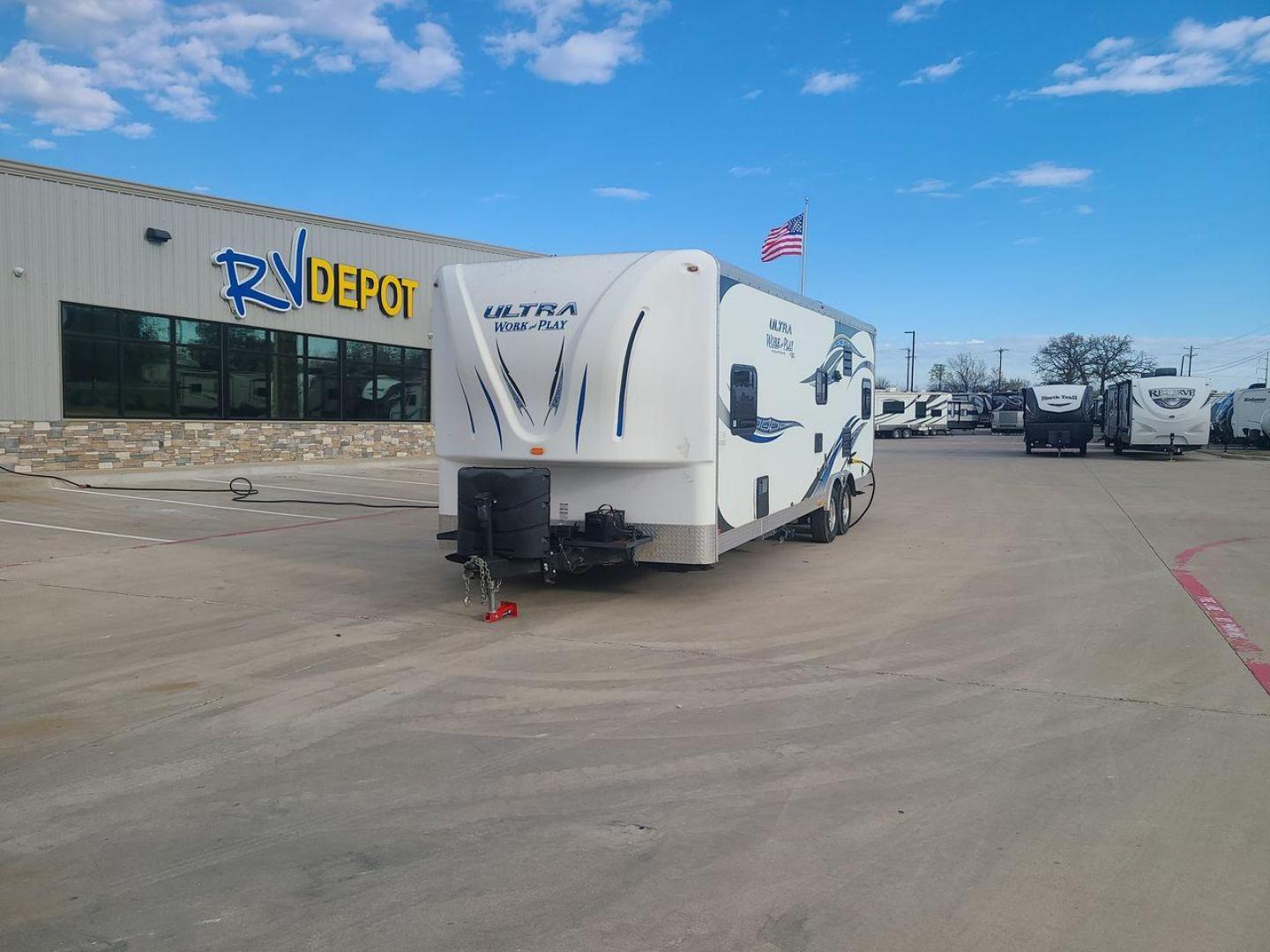 2014 WHITE FOREST RIVER WORK AND PLAY 25UDT (4X4TWPA21EB) , Length: 30.42 ft. | Dry Weight: 6,201 lbs. | Gross Weight: 9,987 lbs. | Slides: 0 transmission, located at 4319 N Main St, Cleburne, TX, 76033, (817) 678-5133, 32.385960, -97.391212 - With the 2014 Forest River Work and Play 25UDT Toy Hauler, unleash the excitement of exploration. For people who want the comforts of home away from home combined with the excitement of outdoor activities, this tough and adaptable RV is ideal. The dimensions of this toy hauler are 30.42 ft in len - Photo#0