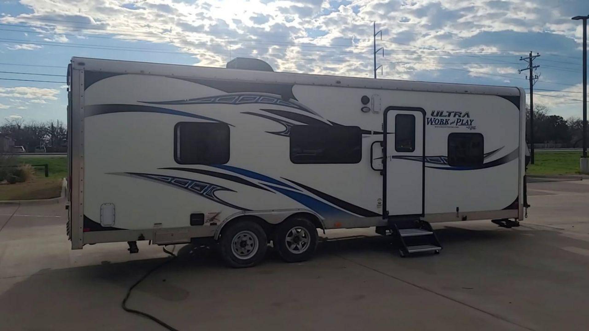 2014 WHITE FOREST RIVER WORK AND PLAY 25UDT (4X4TWPA21EB) , Length: 30.42 ft. | Dry Weight: 6,201 lbs. | Gross Weight: 9,987 lbs. | Slides: 0 transmission, located at 4319 N Main St, Cleburne, TX, 76033, (817) 678-5133, 32.385960, -97.391212 - With the 2014 Forest River Work and Play 25UDT Toy Hauler, unleash the excitement of exploration. For people who want the comforts of home away from home combined with the excitement of outdoor activities, this tough and adaptable RV is ideal. The dimensions of this toy hauler are 30.42 ft in len - Photo#1