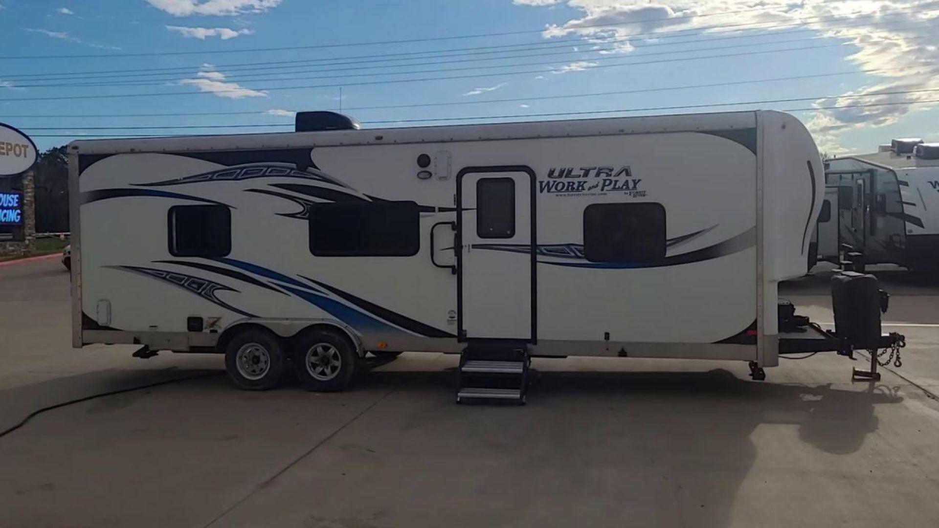 2014 WHITE FOREST RIVER WORK AND PLAY 25UDT (4X4TWPA21EB) , Length: 30.42 ft. | Dry Weight: 6,201 lbs. | Gross Weight: 9,987 lbs. | Slides: 0 transmission, located at 4319 N Main St, Cleburne, TX, 76033, (817) 678-5133, 32.385960, -97.391212 - With the 2014 Forest River Work and Play 25UDT Toy Hauler, unleash the excitement of exploration. For people who want the comforts of home away from home combined with the excitement of outdoor activities, this tough and adaptable RV is ideal. The dimensions of this toy hauler are 30.42 ft in len - Photo#2