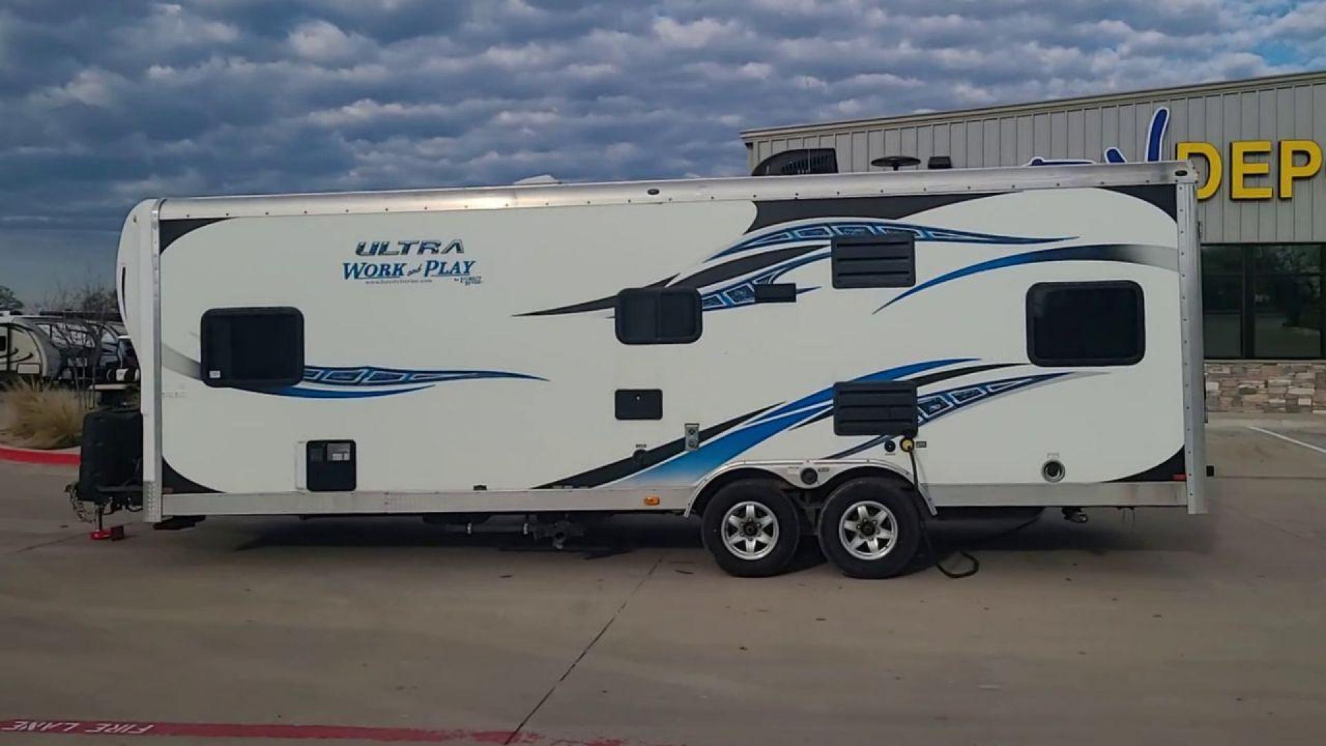 2014 WHITE FOREST RIVER WORK AND PLAY 25UDT (4X4TWPA21EB) , Length: 30.42 ft. | Dry Weight: 6,201 lbs. | Gross Weight: 9,987 lbs. | Slides: 0 transmission, located at 4319 N Main St, Cleburne, TX, 76033, (817) 678-5133, 32.385960, -97.391212 - With the 2014 Forest River Work and Play 25UDT Toy Hauler, unleash the excitement of exploration. For people who want the comforts of home away from home combined with the excitement of outdoor activities, this tough and adaptable RV is ideal. The dimensions of this toy hauler are 30.42 ft in len - Photo#6