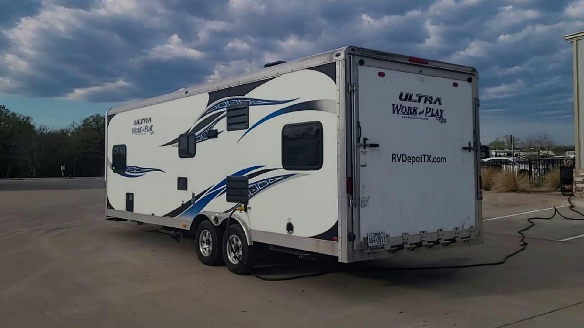 2014 WHITE FOREST RIVER WORK AND PLAY 25UDT (4X4TWPA21EB) , Length: 30.42 ft. | Dry Weight: 6,201 lbs. | Gross Weight: 9,987 lbs. | Slides: 0 transmission, located at 4319 N Main St, Cleburne, TX, 76033, (817) 678-5133, 32.385960, -97.391212 - With the 2014 Forest River Work and Play 25UDT Toy Hauler, unleash the excitement of exploration. For people who want the comforts of home away from home combined with the excitement of outdoor activities, this tough and adaptable RV is ideal. The dimensions of this toy hauler are 30.42 ft in len - Photo#7