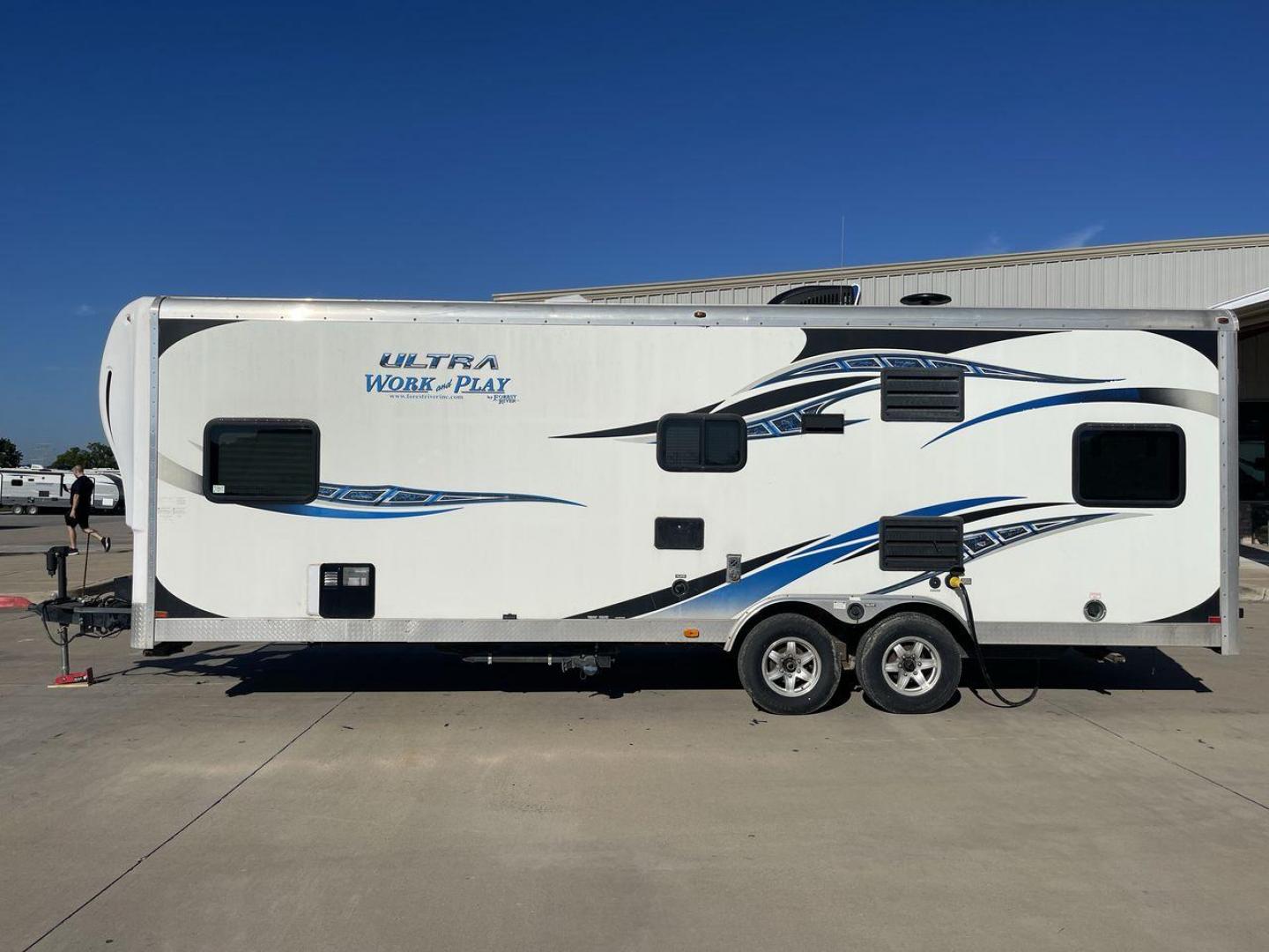 2014 WHITE FOREST RIVER WORK AND PLAY 25UDT (4X4TWPA21EB) , Length: 30.42 ft. | Dry Weight: 6,201 lbs. | Gross Weight: 9,987 lbs. | Slides: 0 transmission, located at 4319 N Main St, Cleburne, TX, 76033, (817) 678-5133, 32.385960, -97.391212 - With the 2014 Forest River Work and Play 25UDT Toy Hauler, unleash the excitement of exploration. For people who want the comforts of home away from home combined with the excitement of outdoor activities, this tough and adaptable RV is ideal. The dimensions of this toy hauler are 30.42 ft in len - Photo#23