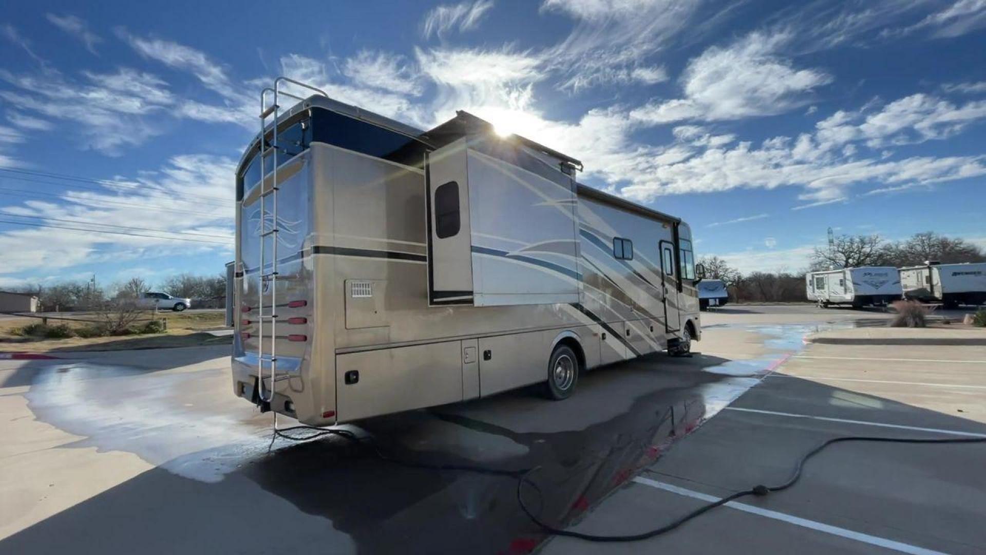 2014 BROWN HOLIDAY RAMBLER VACATIONER 33SFD - (1F66F5DY0D0) with an 6.8L V10 SOHC 30V engine, Length: 35 ft. | Slides: 2 transmission, located at 4319 N Main St, Cleburne, TX, 76033, (817) 678-5133, 32.385960, -97.391212 - The 2014 Holiday Rambler Vacationer 33SFD is a premium Class A motorhome that blends comfort and style for an unparalleled travel experience. This meticulously designed model is built on a Ford F53 chassis, powered by a robust Triton V10 engine to ensure a smooth and powerful ride. The Vacationer 33 - Photo#1