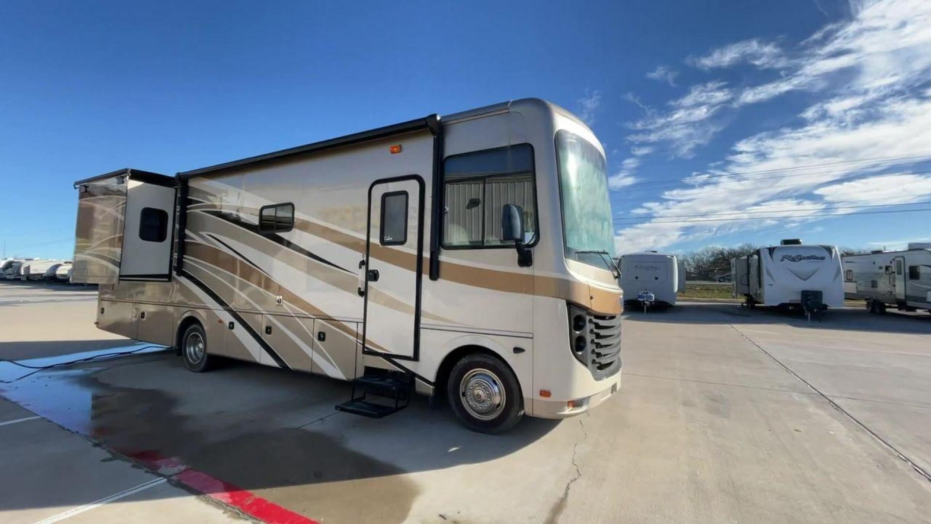 2014 BROWN HOLIDAY RAMBLER VACATIONER 33SFD - (1F66F5DY0D0) with an 6.8L V10 SOHC 30V engine, Length: 35 ft. | Slides: 2 transmission, located at 4319 N Main St, Cleburne, TX, 76033, (817) 678-5133, 32.385960, -97.391212 - The 2014 Holiday Rambler Vacationer 33SFD is a premium Class A motorhome that blends comfort and style for an unparalleled travel experience. This meticulously designed model is built on a Ford F53 chassis, powered by a robust Triton V10 engine to ensure a smooth and powerful ride. The Vacationer 33 - Photo#3