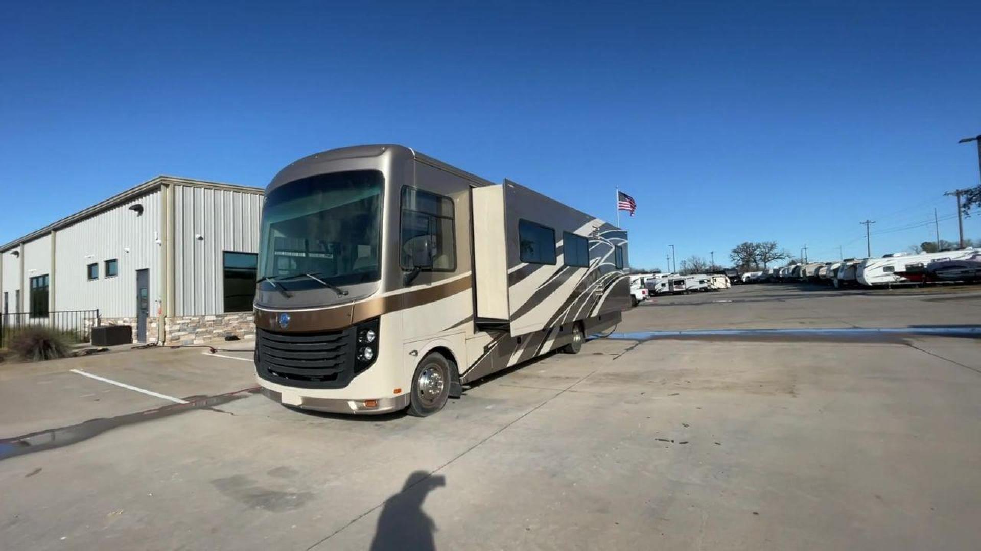 2014 BROWN HOLIDAY RAMBLER VACATIONER 33SFD - (1F66F5DY0D0) with an 6.8L V10 SOHC 30V engine, Length: 35 ft. | Slides: 2 transmission, located at 4319 N Main St, Cleburne, TX, 76033, (817) 678-5133, 32.385960, -97.391212 - The 2014 Holiday Rambler Vacationer 33SFD is a premium Class A motorhome that blends comfort and style for an unparalleled travel experience. This meticulously designed model is built on a Ford F53 chassis, powered by a robust Triton V10 engine to ensure a smooth and powerful ride. The Vacationer 33 - Photo#5