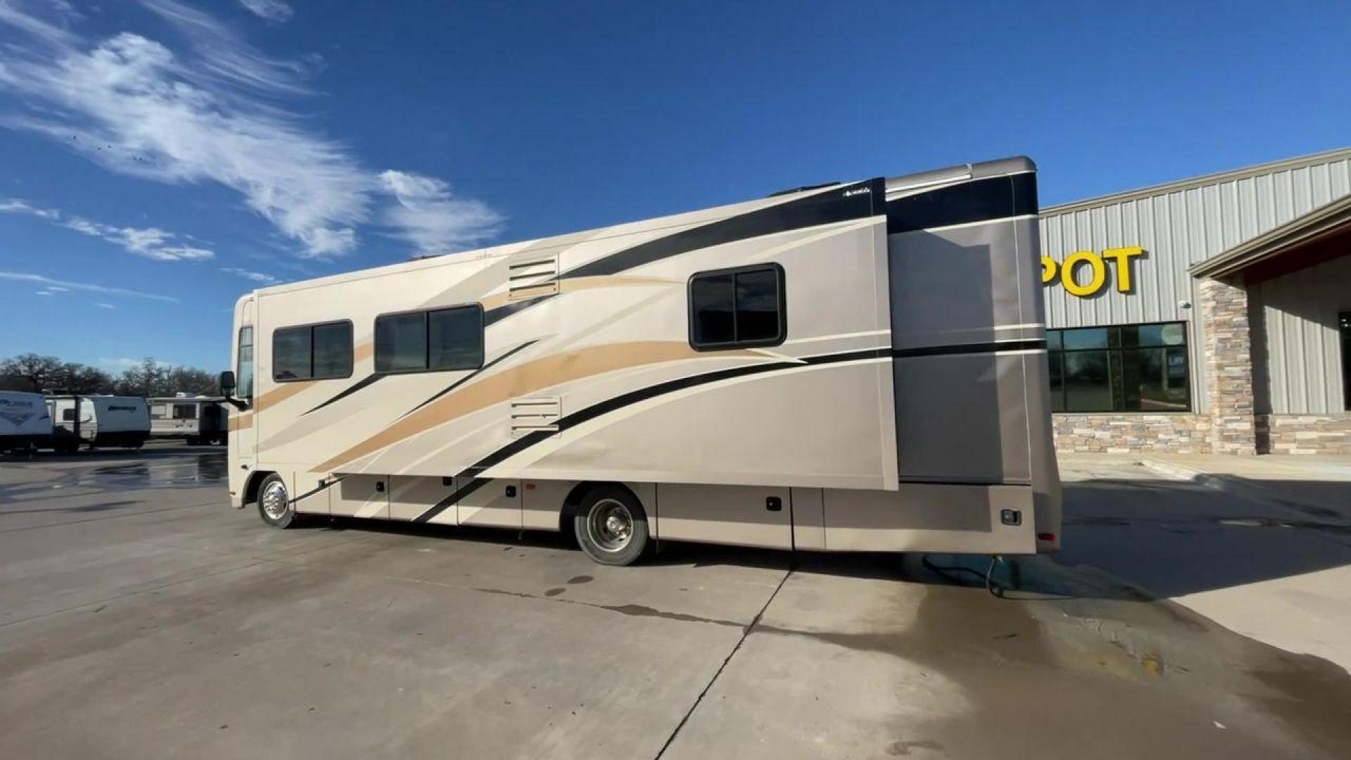 2014 BROWN HOLIDAY RAMBLER VACATIONER 33SFD - (1F66F5DY0D0) with an 6.8L V10 SOHC 30V engine, Length: 35 ft. | Slides: 2 transmission, located at 4319 N Main St, Cleburne, TX, 76033, (817) 678-5133, 32.385960, -97.391212 - The 2014 Holiday Rambler Vacationer 33SFD is a premium Class A motorhome that blends comfort and style for an unparalleled travel experience. This meticulously designed model is built on a Ford F53 chassis, powered by a robust Triton V10 engine to ensure a smooth and powerful ride. The Vacationer 33 - Photo#7