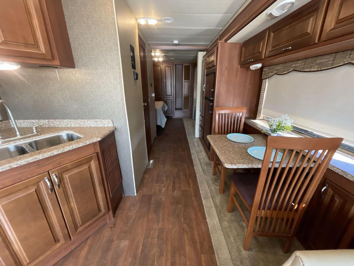 2014 BROWN HOLIDAY RAMBLER VACATIONER 33SFD - (1F66F5DY0D0) with an 6.8L V10 SOHC 30V engine, Length: 35 ft. | Slides: 2 transmission, located at 4319 N Main St, Cleburne, TX, 76033, (817) 678-5133, 32.385960, -97.391212 - The 2014 Holiday Rambler Vacationer 33SFD is a premium Class A motorhome that blends comfort and style for an unparalleled travel experience. This meticulously designed model is built on a Ford F53 chassis, powered by a robust Triton V10 engine to ensure a smooth and powerful ride. The Vacationer 33 - Photo#13